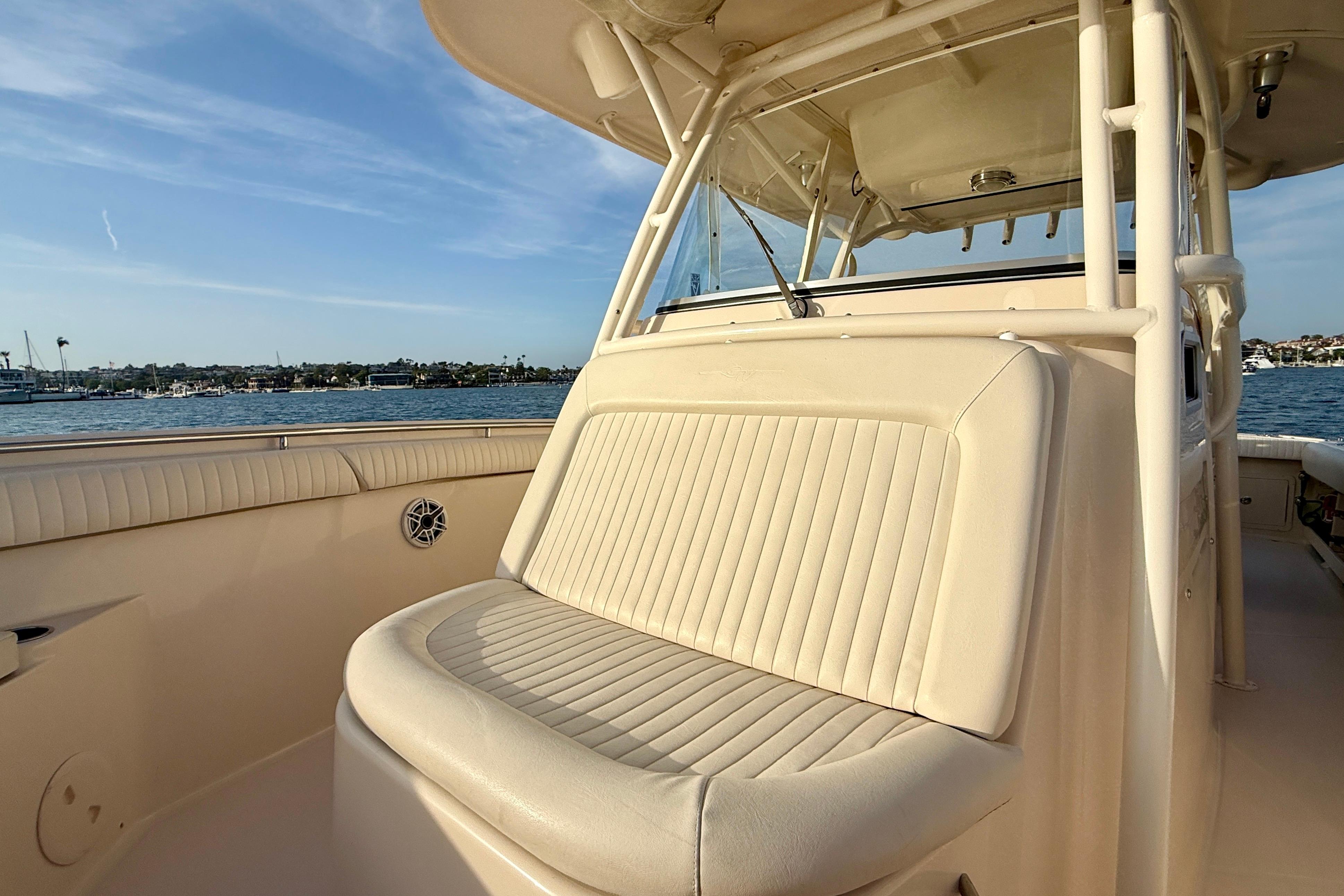 2012 Grady-White Canyon 336 boat interior with cushioned seating, overlooking serene waters.