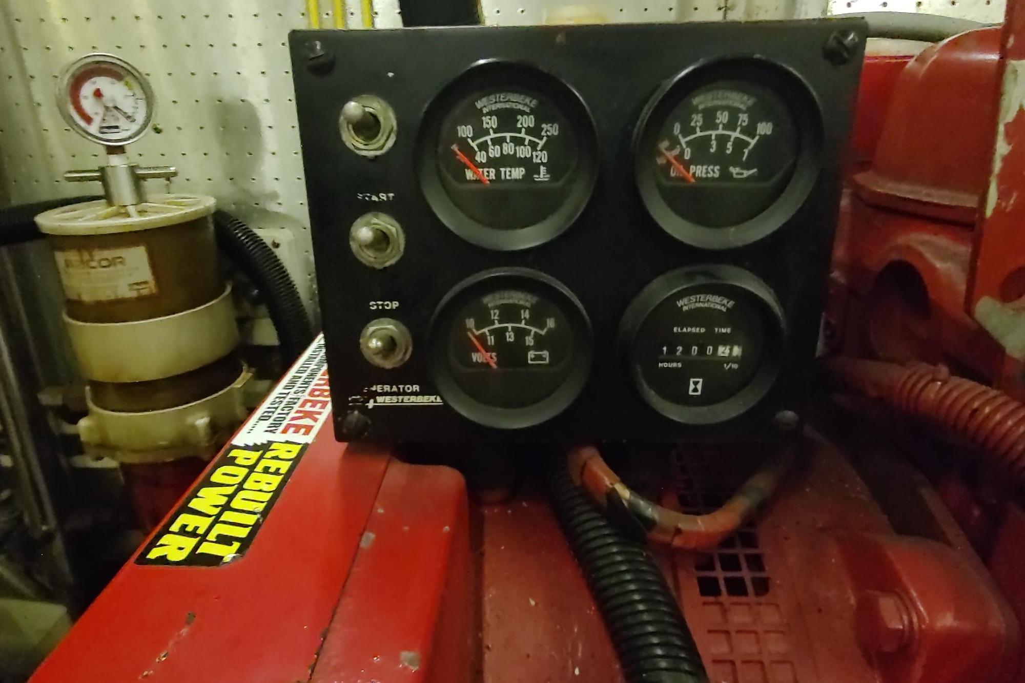 Engine control panel of a 1989 Hyatt Double Cabin Motoryacht, featuring gauges and switches.