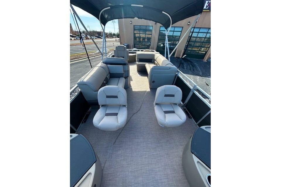 2025 Sun Tracker Fishin' Barge 20 DLX interior with spacious seating and canopy.