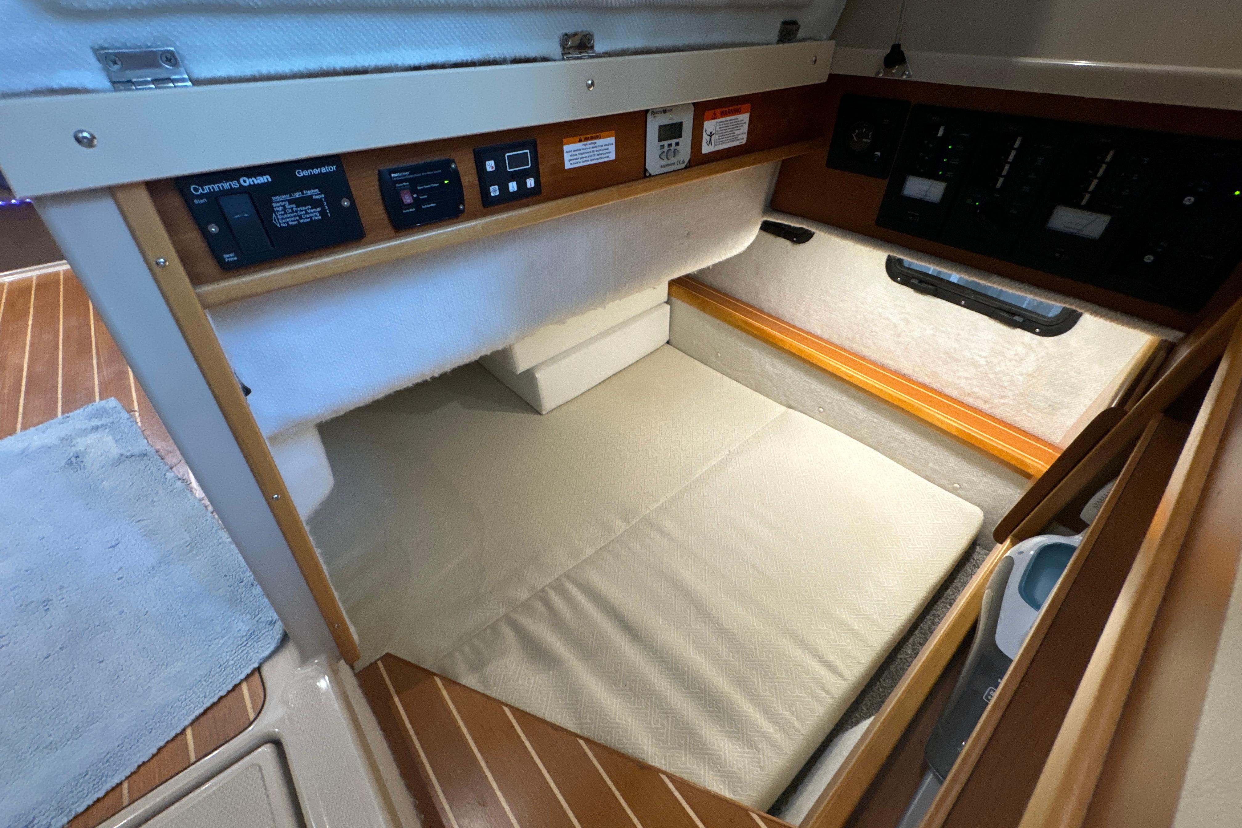 Interior cabin of 2017 Cutwater C-30 Sedan boat with control panels and cushioned seating.