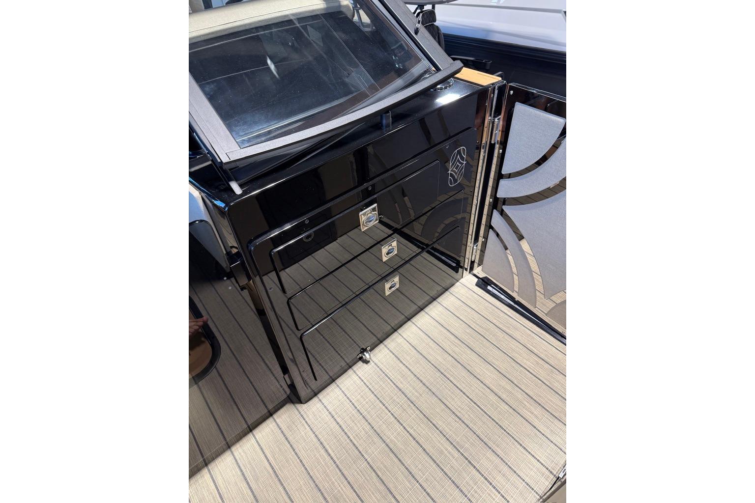 Sleek black cabinetry on the 2026 Balise Halo 26C Twin boat deck.