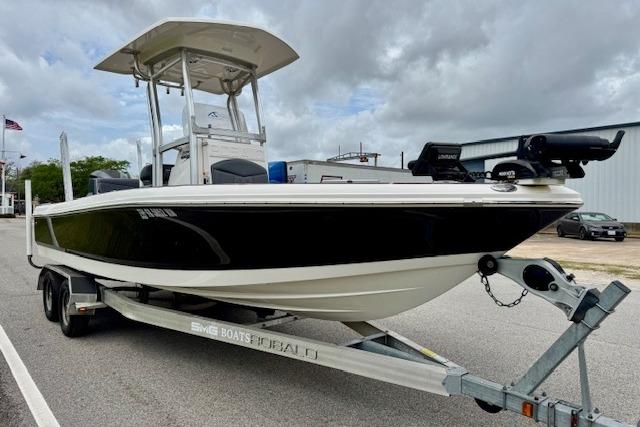 2015 Robalo 226 Cayman boat on trailer, black and white design, parked outdoors.