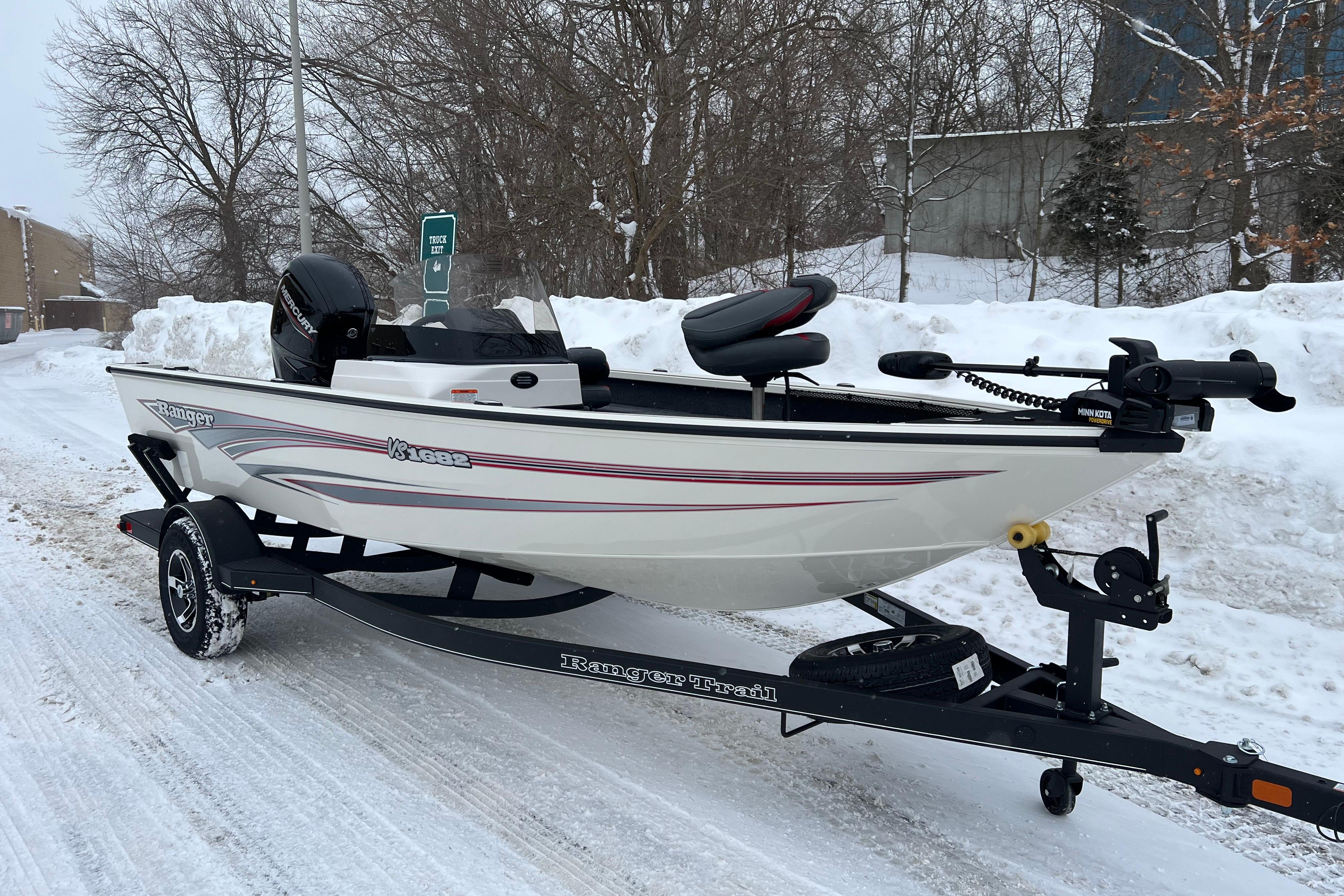 2026 Ranger VS1682SC Angler boat on snowy road, equipped with trailer.