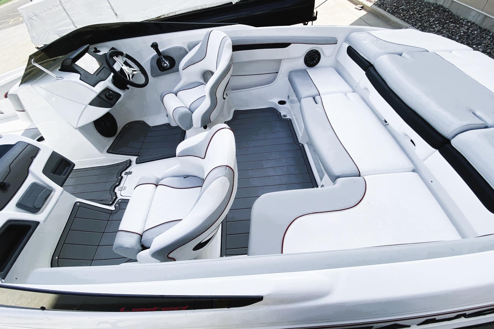 2023 Tahoe 210 Si Limited boat interior with sleek white seating and modern dashboard design.
