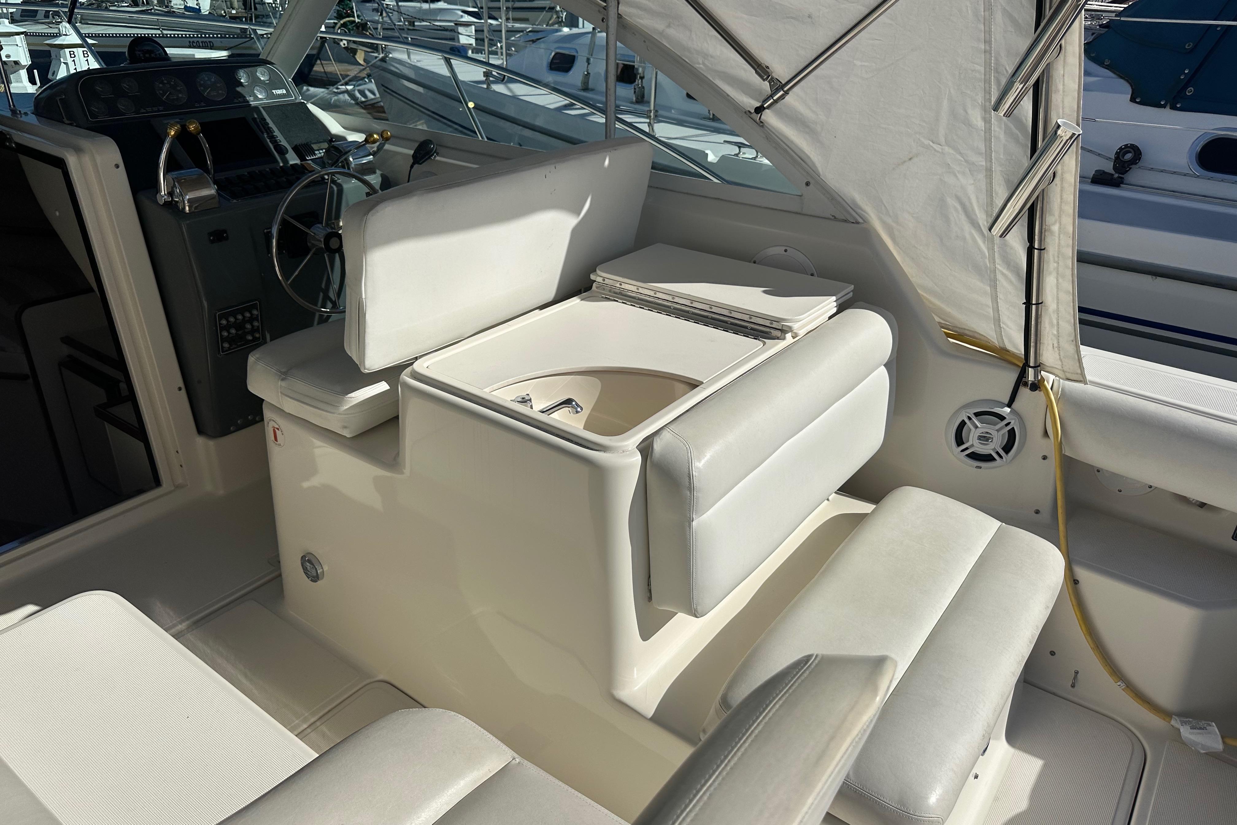 1998 Tiara Yachts 2900 Coronet interior with helm, seating, and nautical equipment.