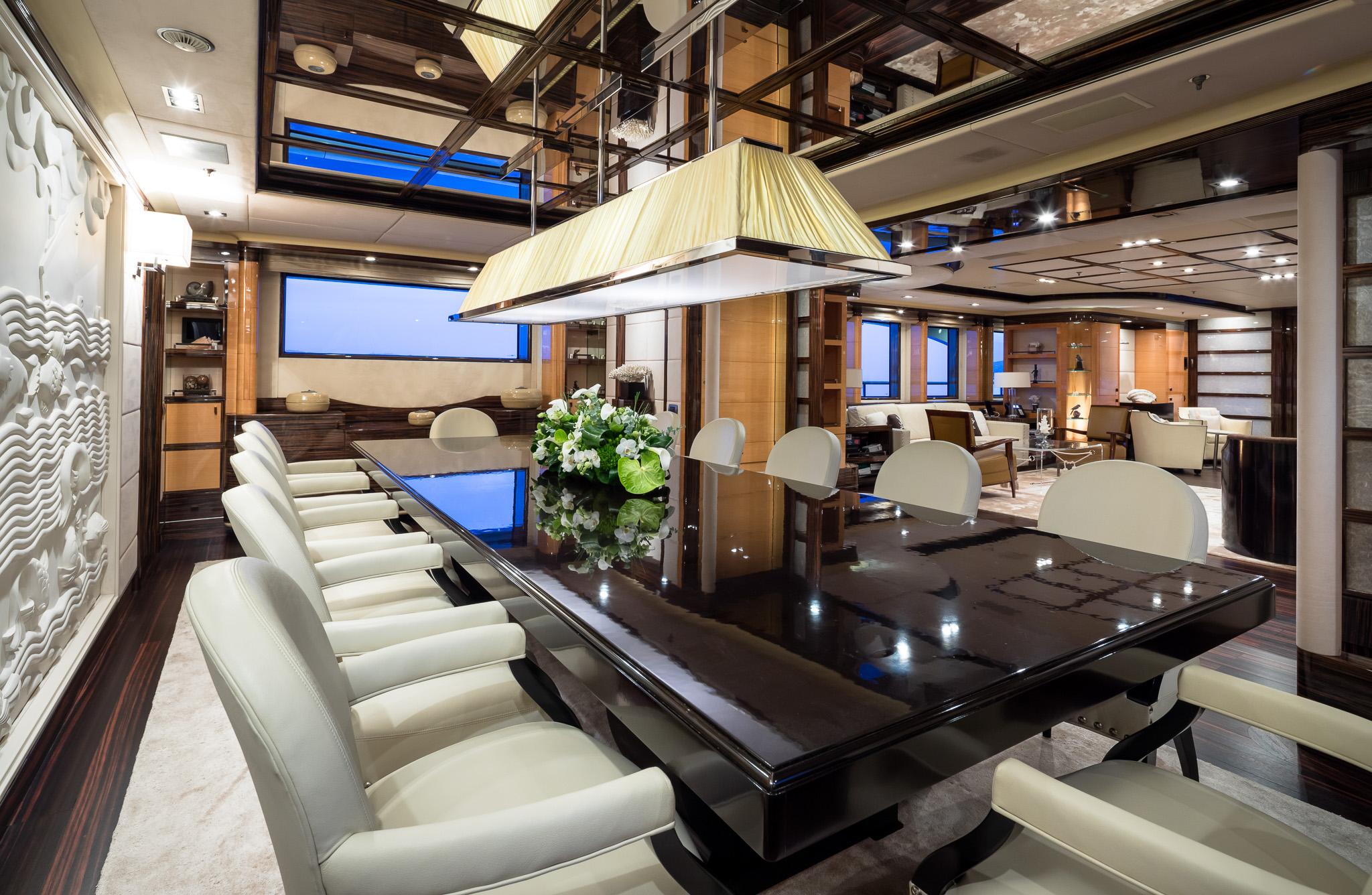 Luxurious interior of 2011 Benetti 60 yacht with elegant dining area and modern decor.