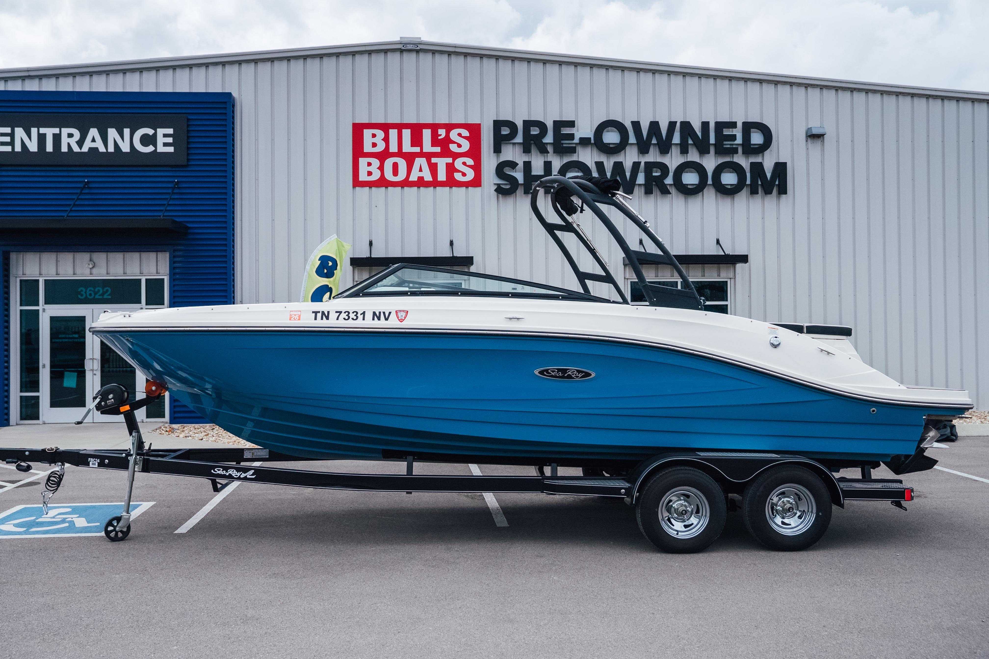 2023 Sea Ray SPX 230 boat on trailer at Bill's Boats showroom.