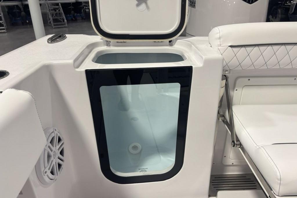 2026 Sportsman Open 252 Center Console boat with open storage compartment.