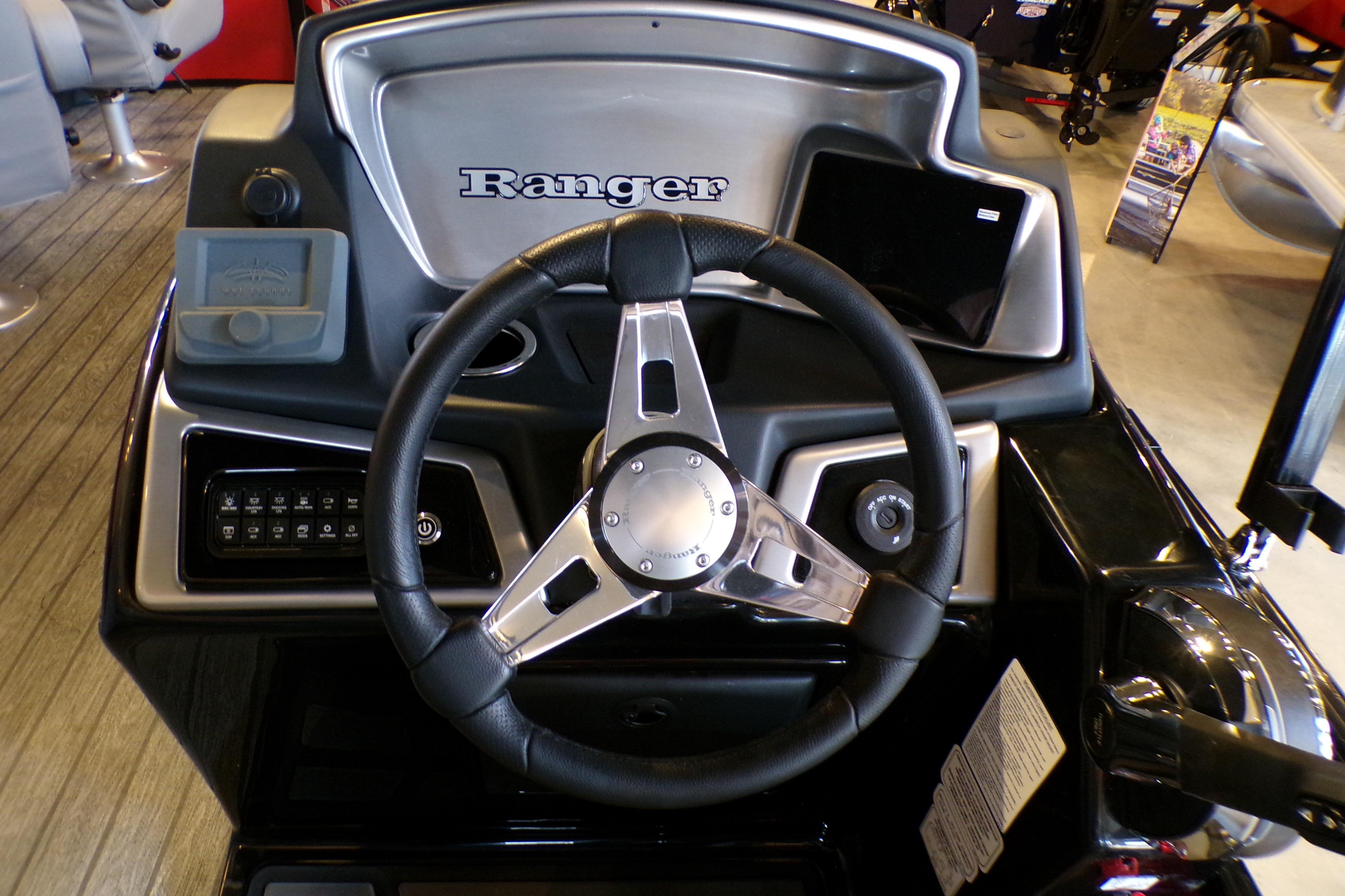 Steering console of 2026 Ranger 220FC boat with modern controls and sleek design.