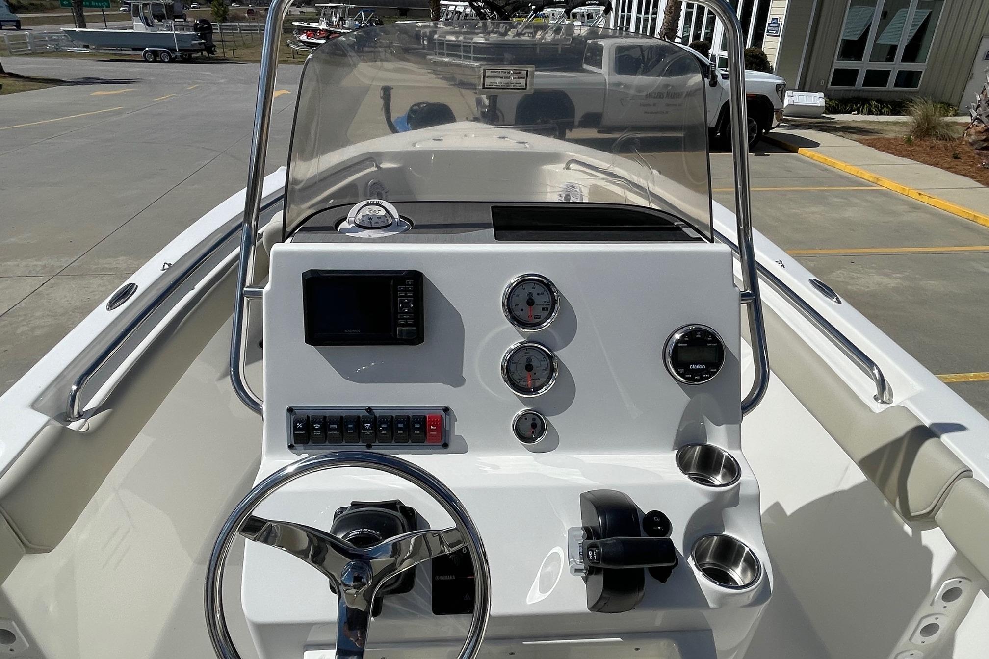 2026 Key West 203 FS boat dashboard with steering wheel, gauges, and controls.