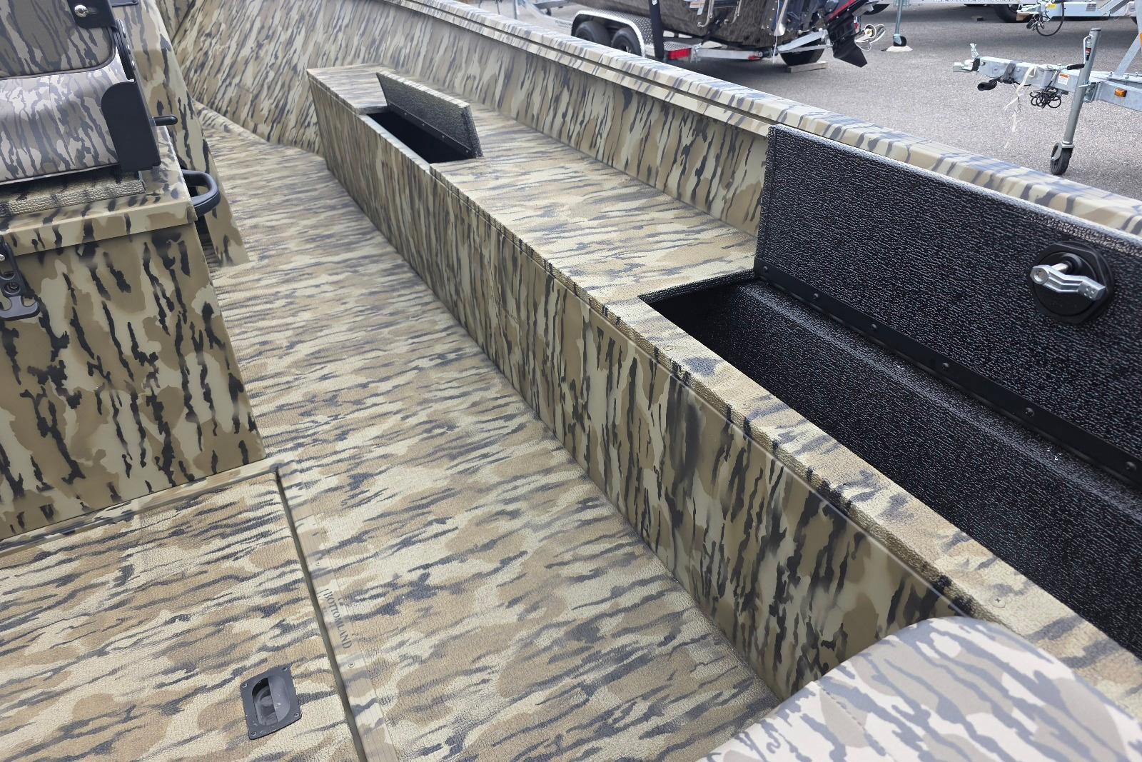 2026 Smoker Craft Freedom 180 CC boat interior with camouflage design and storage compartments.