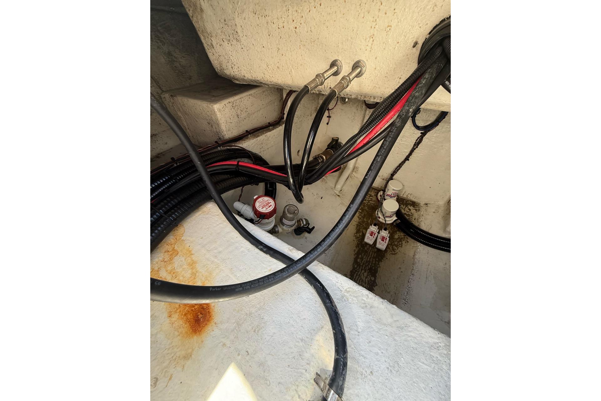 Bilge area of 2021 Custom Infusion 34 CC boat with cables and connectors.