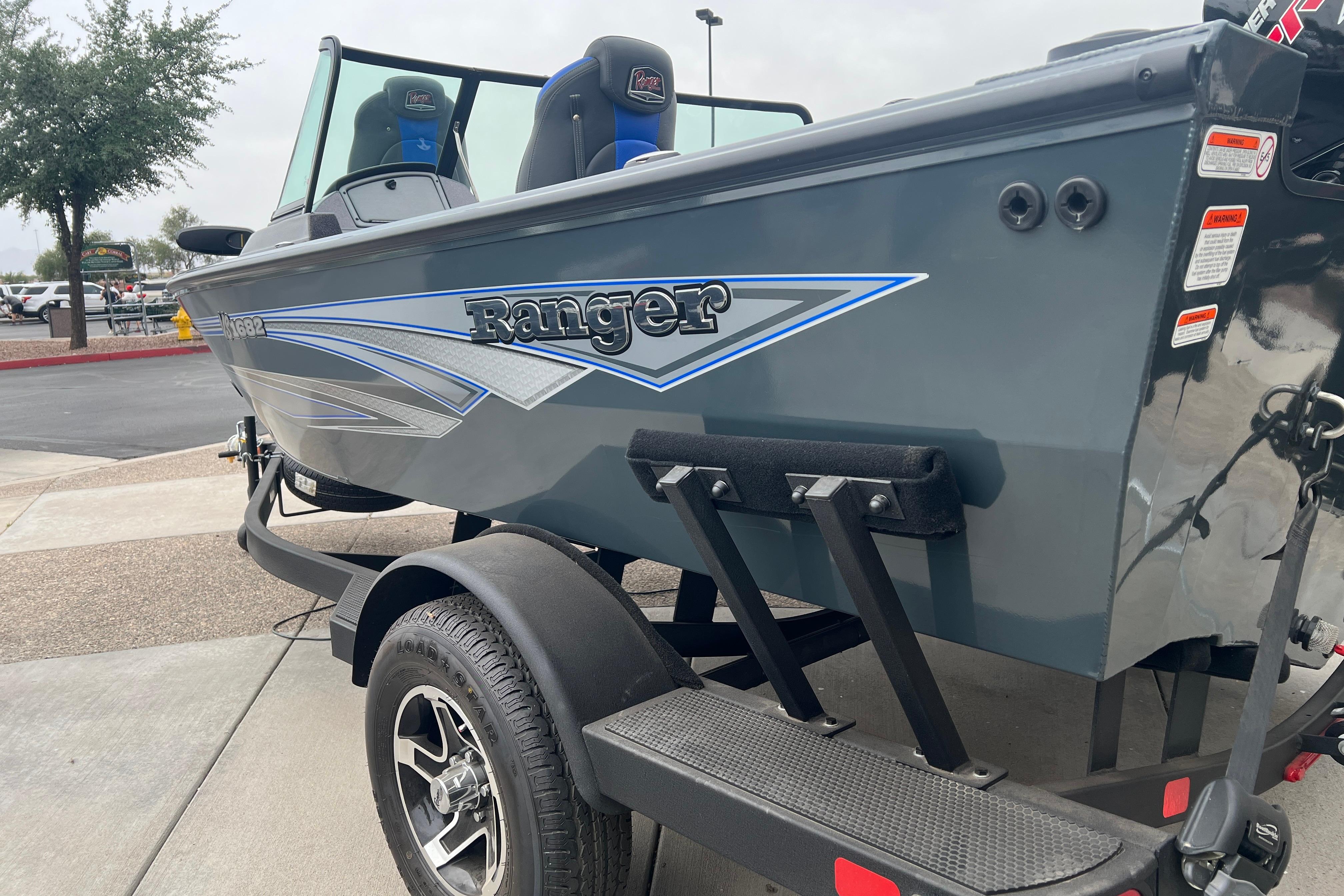 2026 Ranger VS1682SC Angler boat on trailer, showcasing sleek design and branding.
