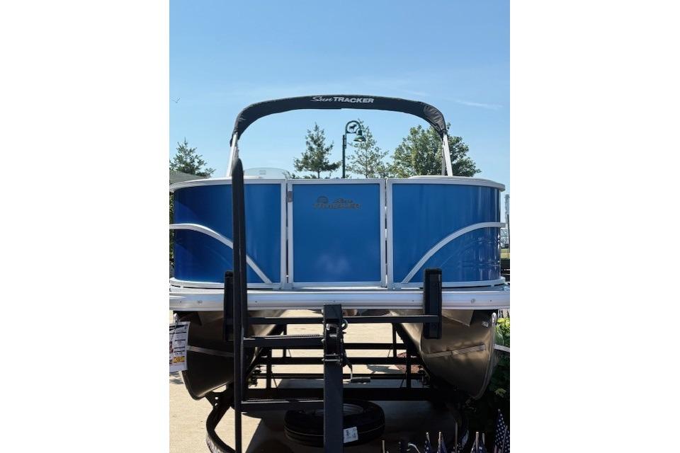 2026 Sun Tracker Party Barge 16 DLX pontoon boat, blue exterior, displayed outdoors.