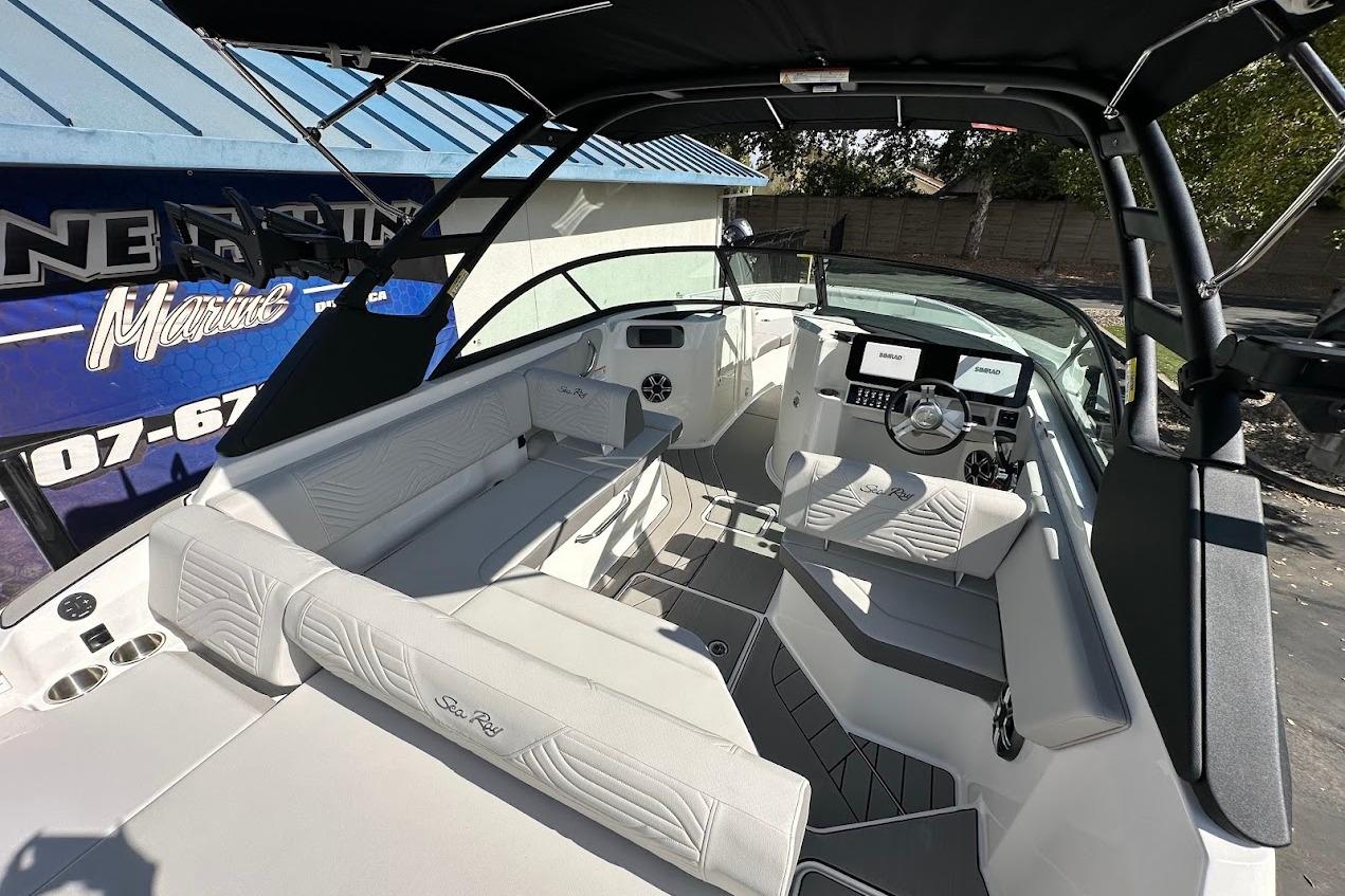 2026 Sea Ray SDX 230 Surf boat interior with modern seating and dashboard.