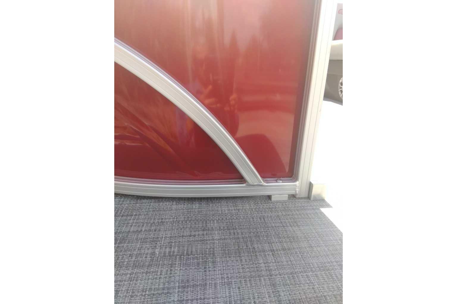 2026 Sun Tracker Party Barge 22 XP3, red paneling and gray flooring detail.