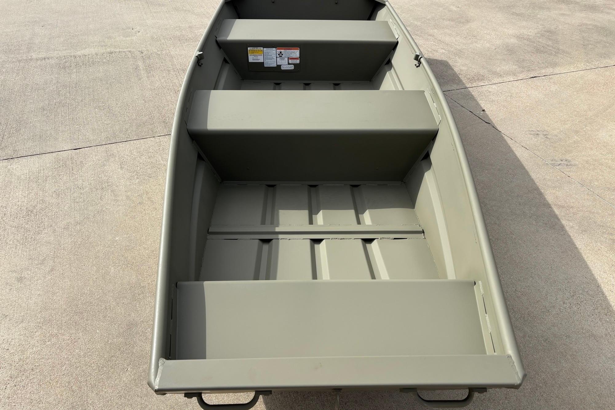 2026 Tracker Grizzly 12 Jon boat, interior view, showcasing seating and storage layout.
