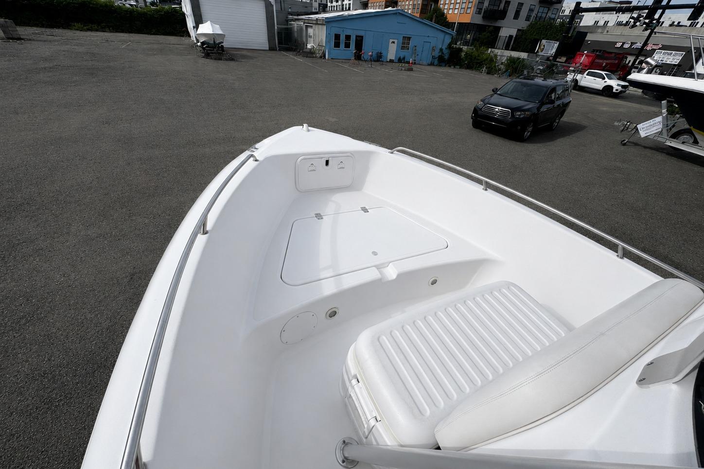 2008 PROLINE 20 Sport boat bow view in a parking lot with buildings in the background.