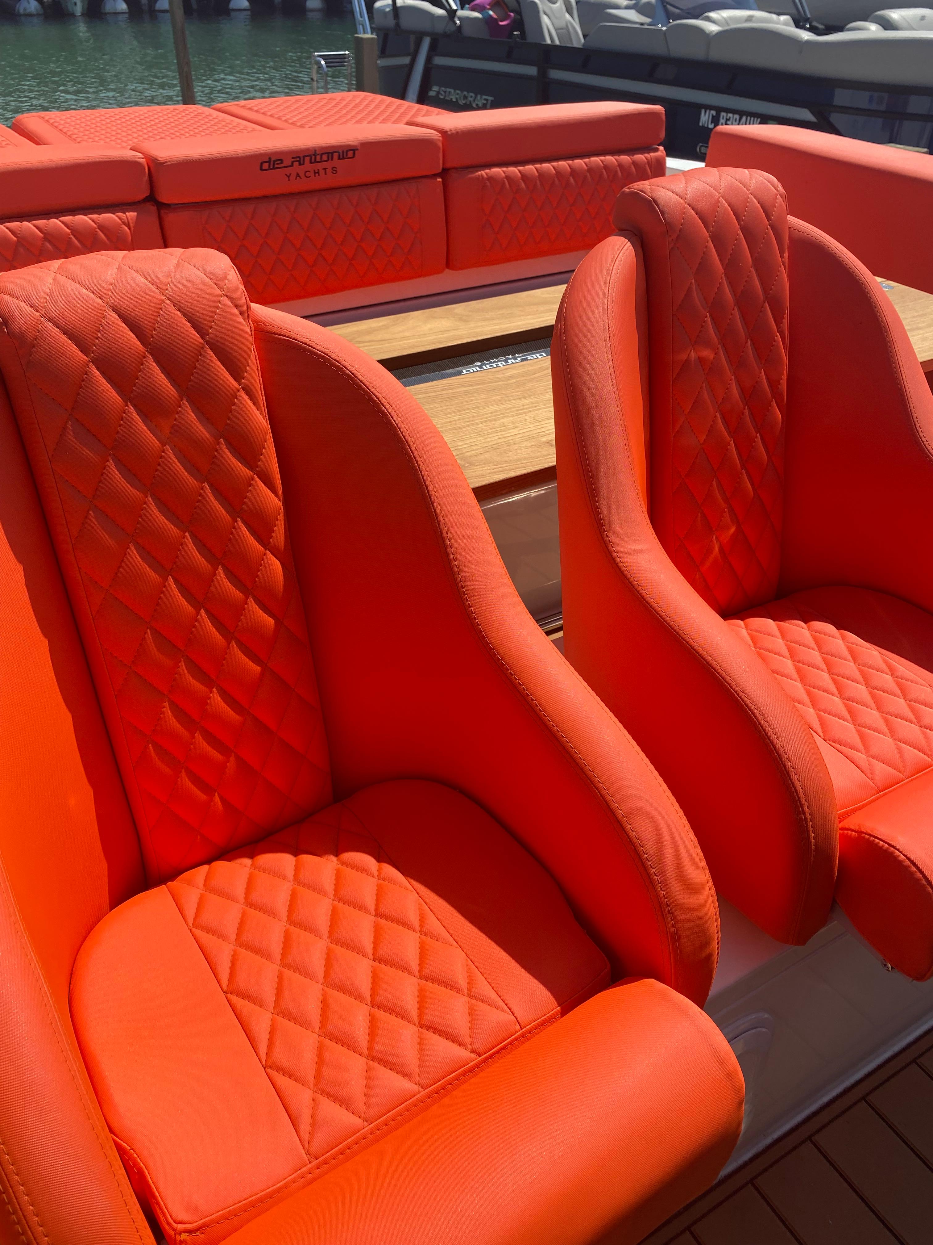 Bright orange seats on a 2020 De Antonio Yachts D 28 model.