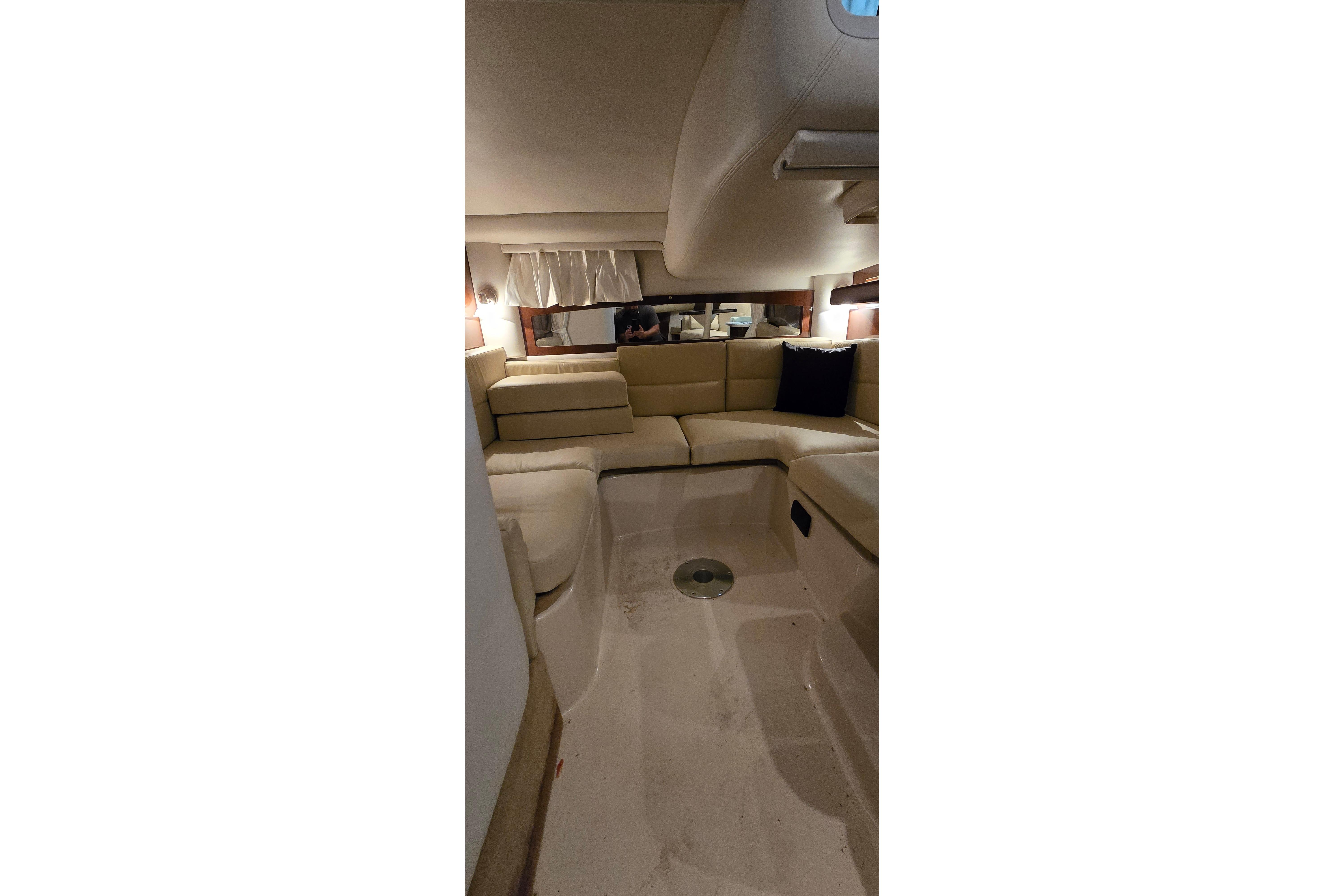 Interior of a 2018 Four Winns V355 yacht with beige seating.