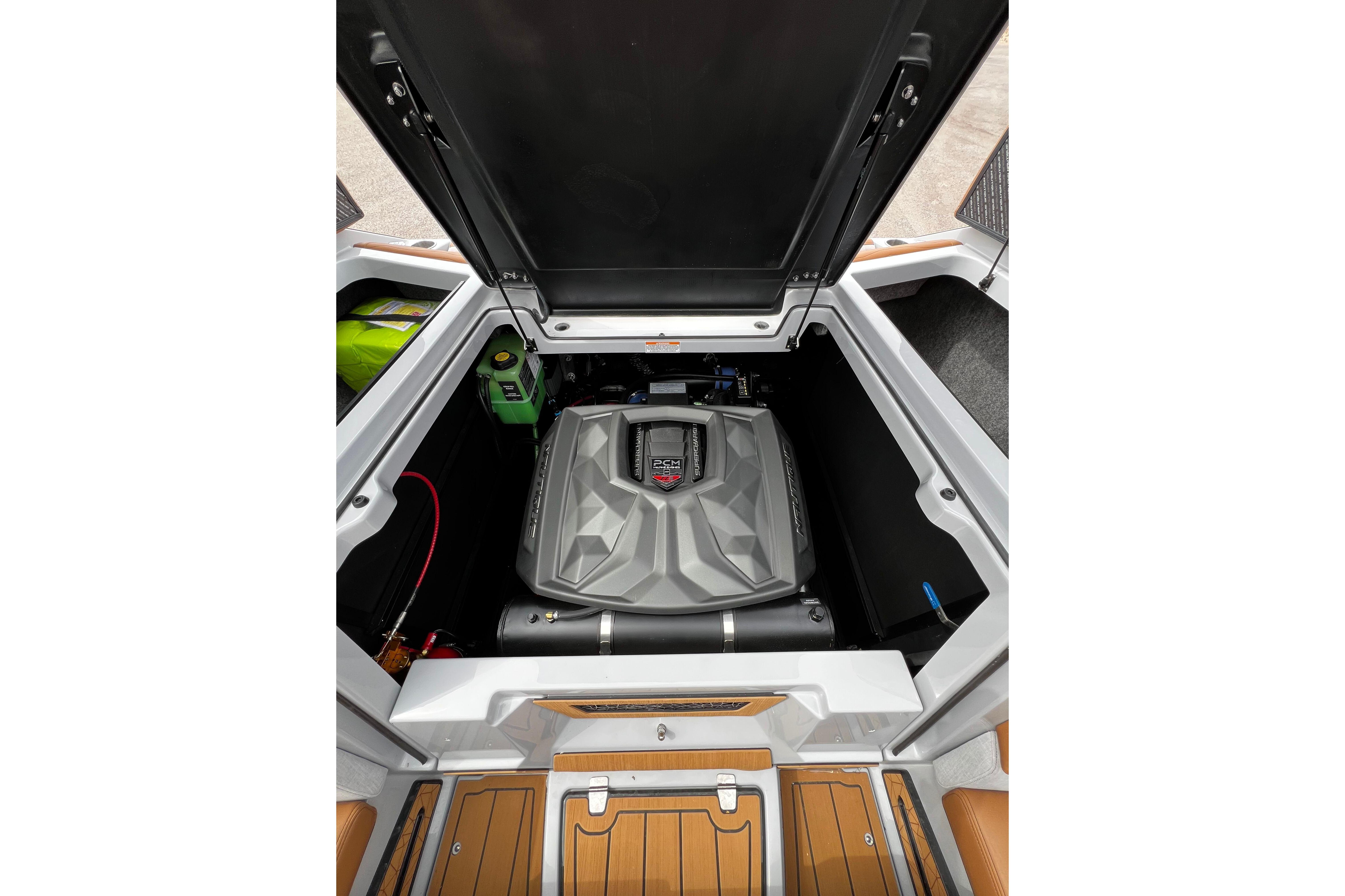 2026 Nautique Super Air Nautique G25 engine compartment with open hatch, showcasing modern design.