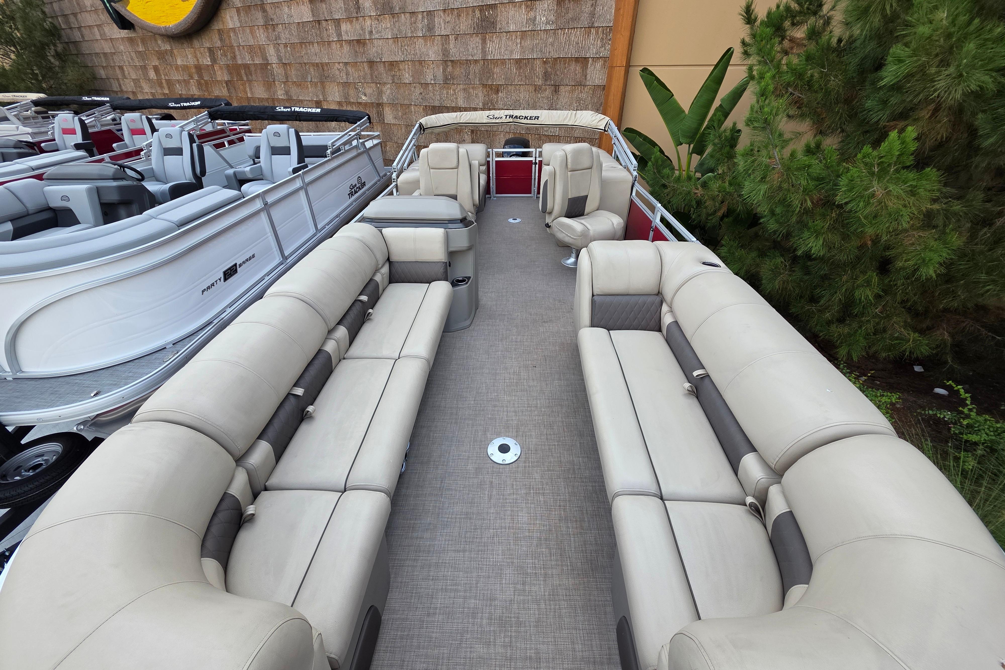 2025 Sun Tracker Party Barge 24 DLX pontoon boat with spacious seating and modern design.