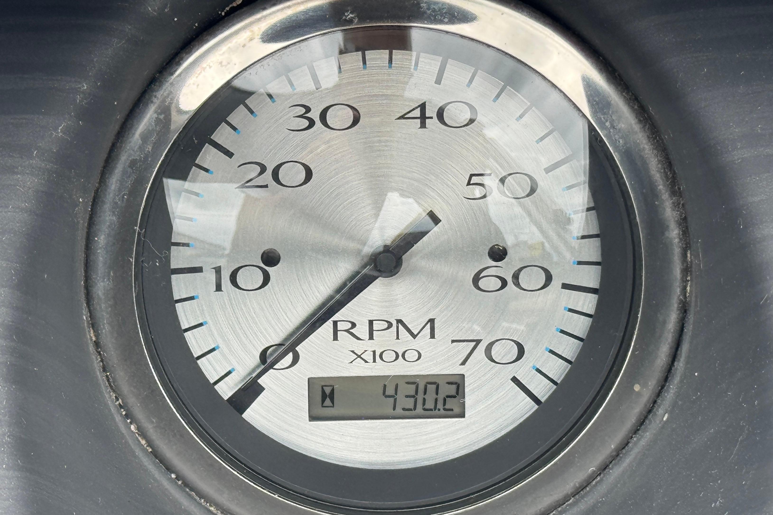 Close-up of a 2019 Bennington SX 22 SSBXP tachometer showing 430.2 RPM.