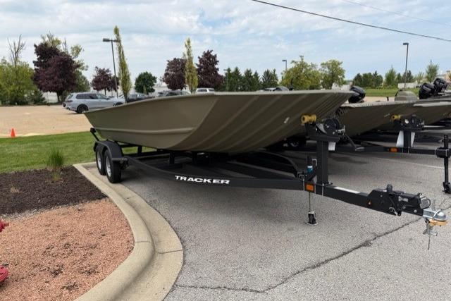 2026 Tracker Grizzly 2072 Utility boat on trailer in parking lot.