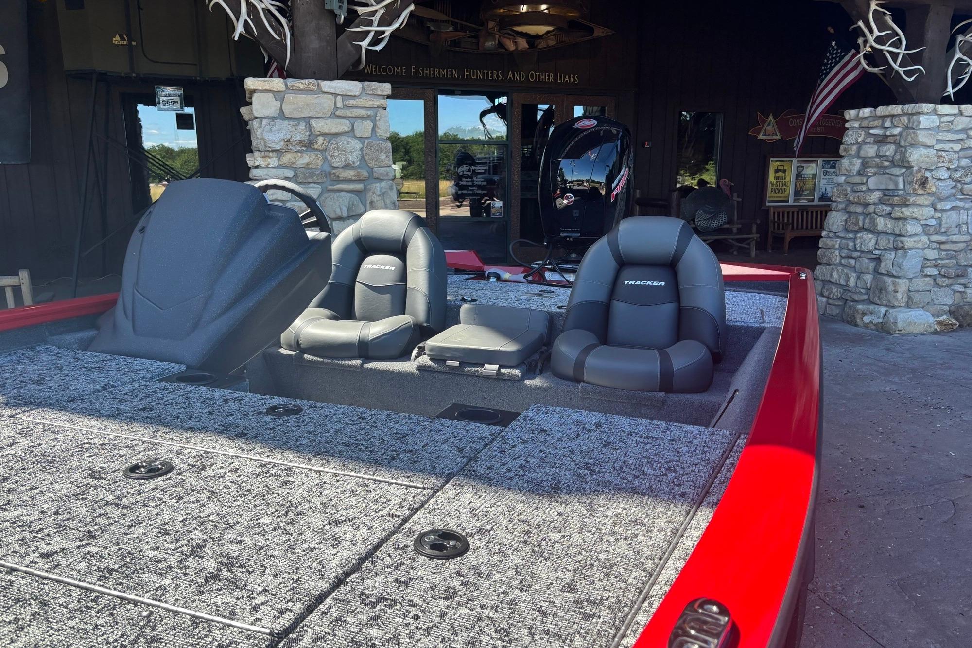 2026 Tracker Pro Team 195 boat with dual seats and red exterior.