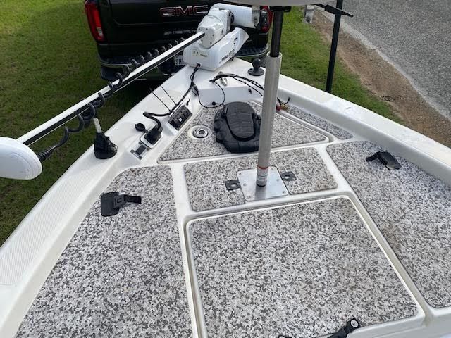 2012 Skeeter ZX200 boat with fishing gear and GMC truck in background.