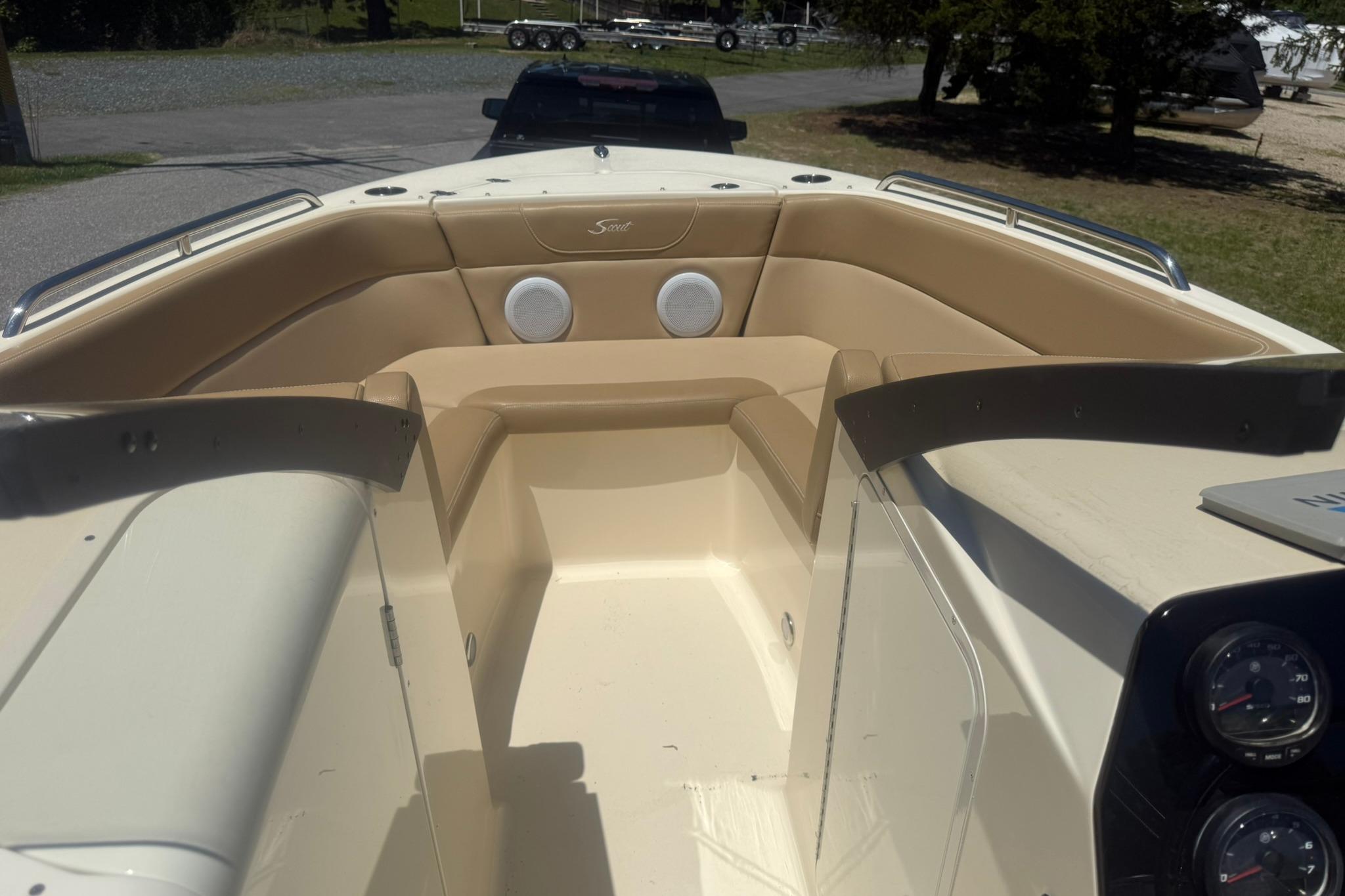2021 Scout 215 Dorado boat interior with tan seating and dashboard gauges.