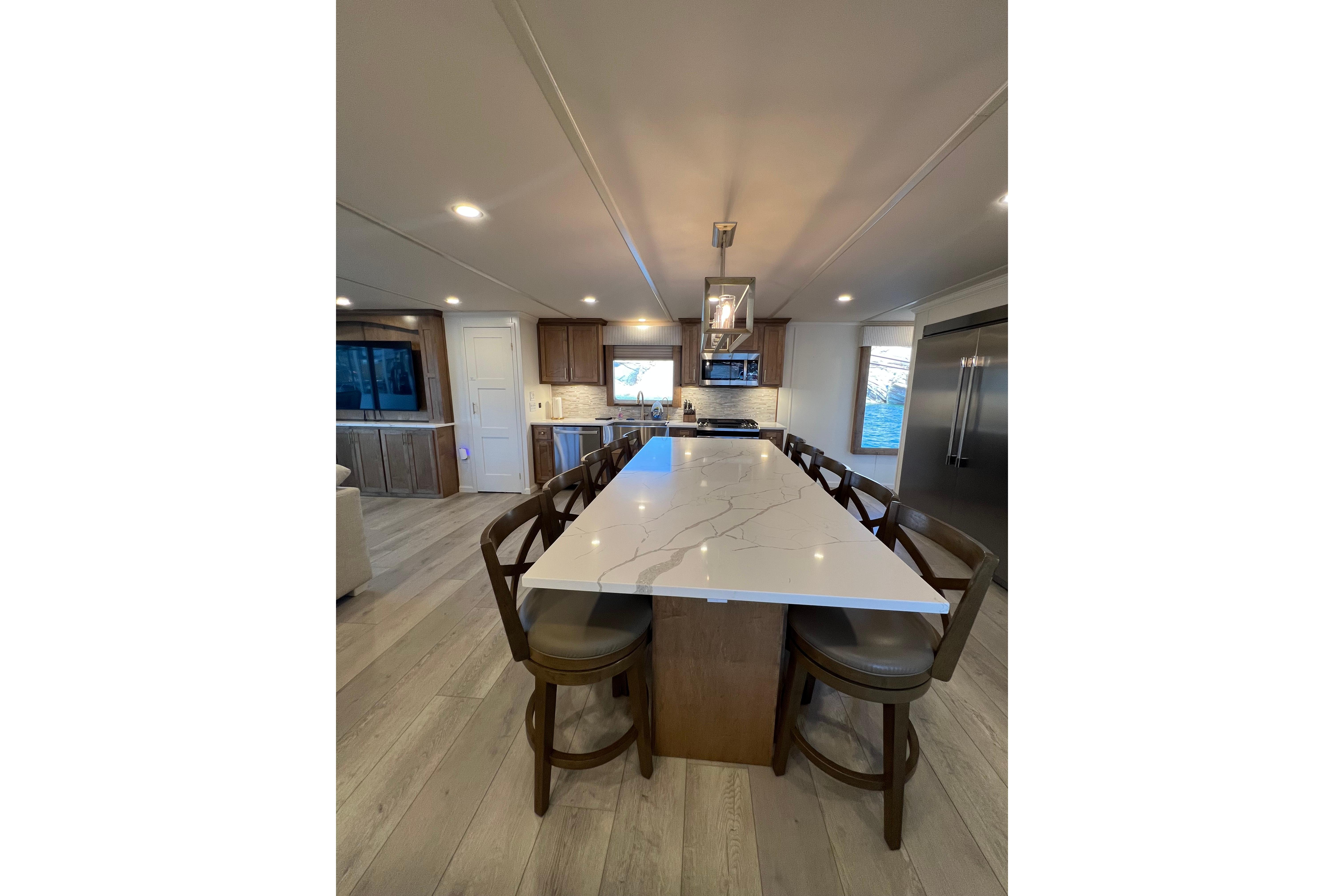 Modern kitchen interior in 2025 Sumerset Excellence Multiple Shares houseboat, featuring a sleek island.