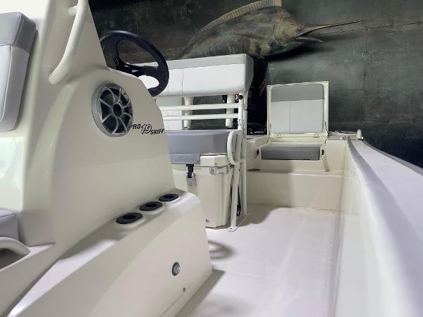 2024 Mako Pro Skiff 19 CC interior with seating and storage compartments.