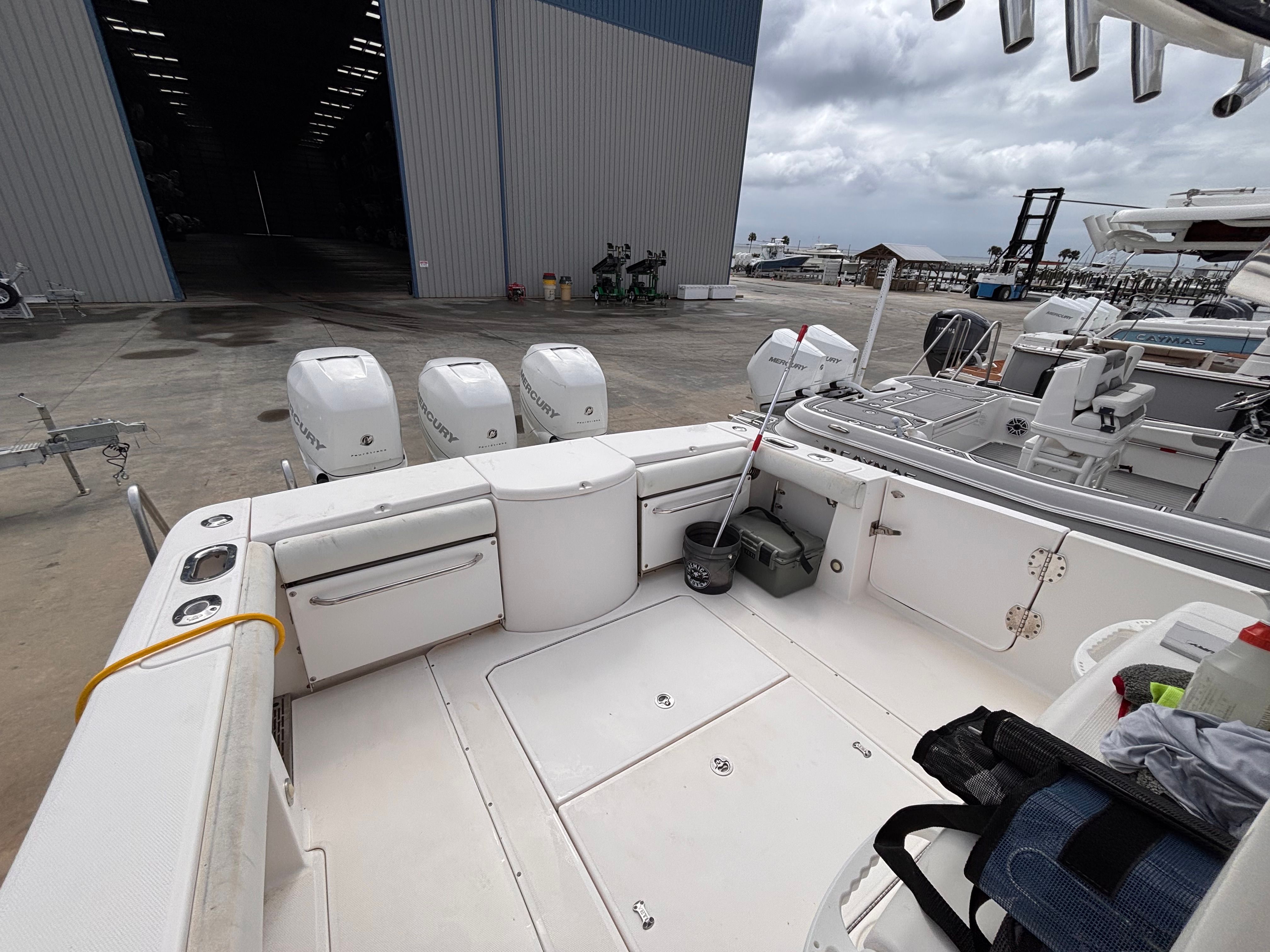 2014 Everglades 355 Tournament boat at dock with three Mercury engines.