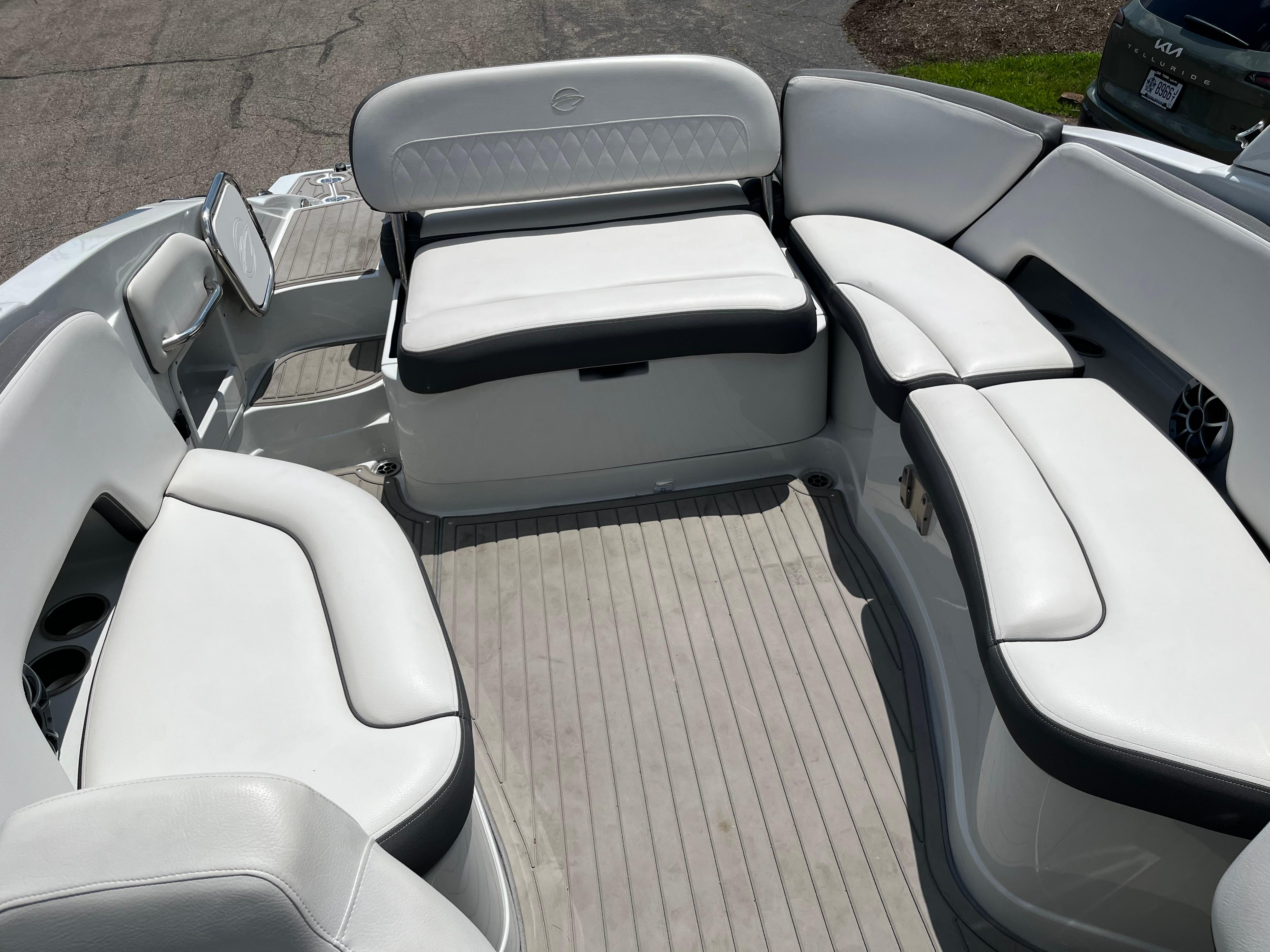 2022 Crownline 280 SS boat interior with white cushioned seating and gray flooring.
