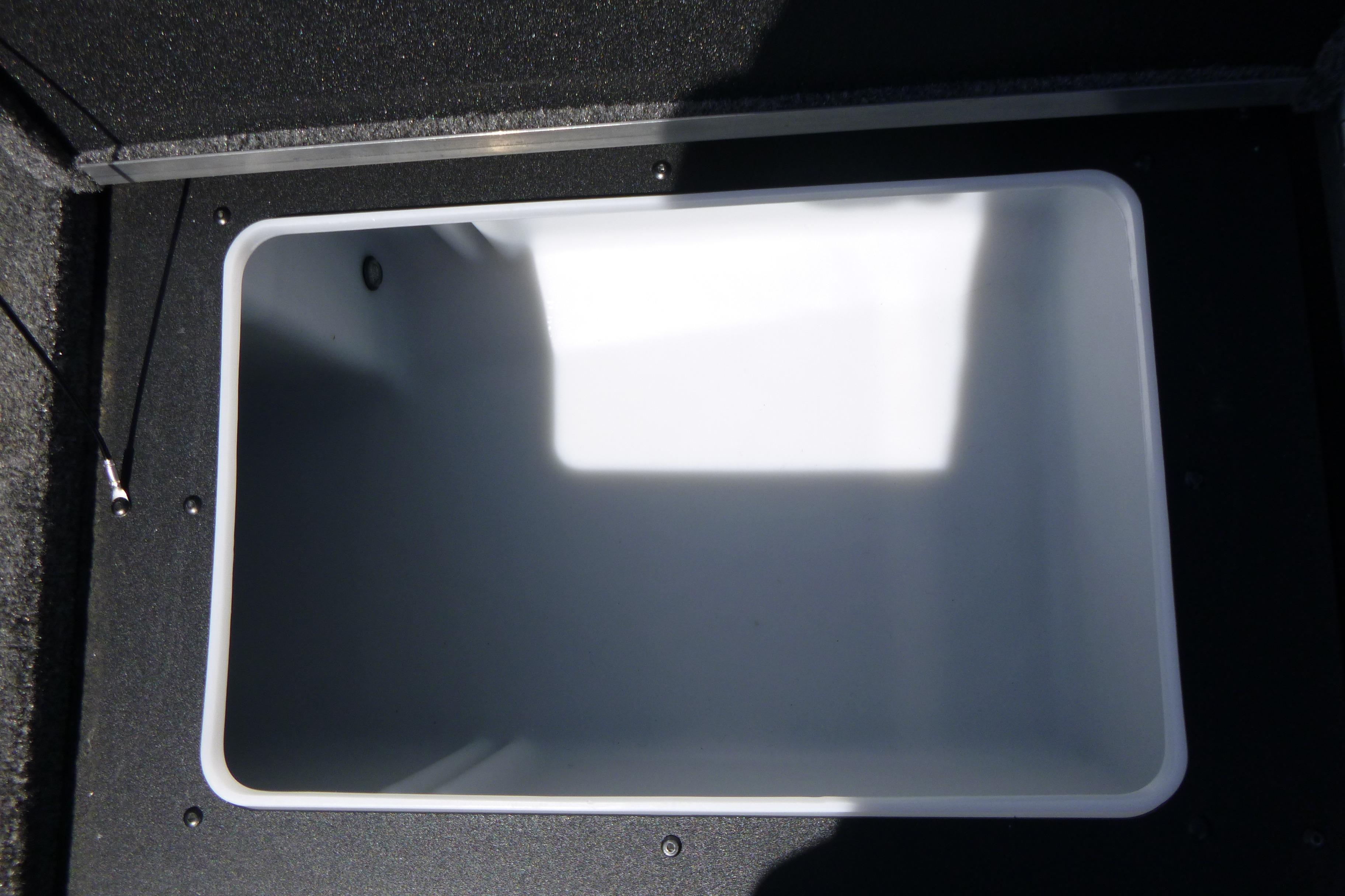 Spacious storage compartment in 2025 Alumacraft Trophy 185X Sport boat.
