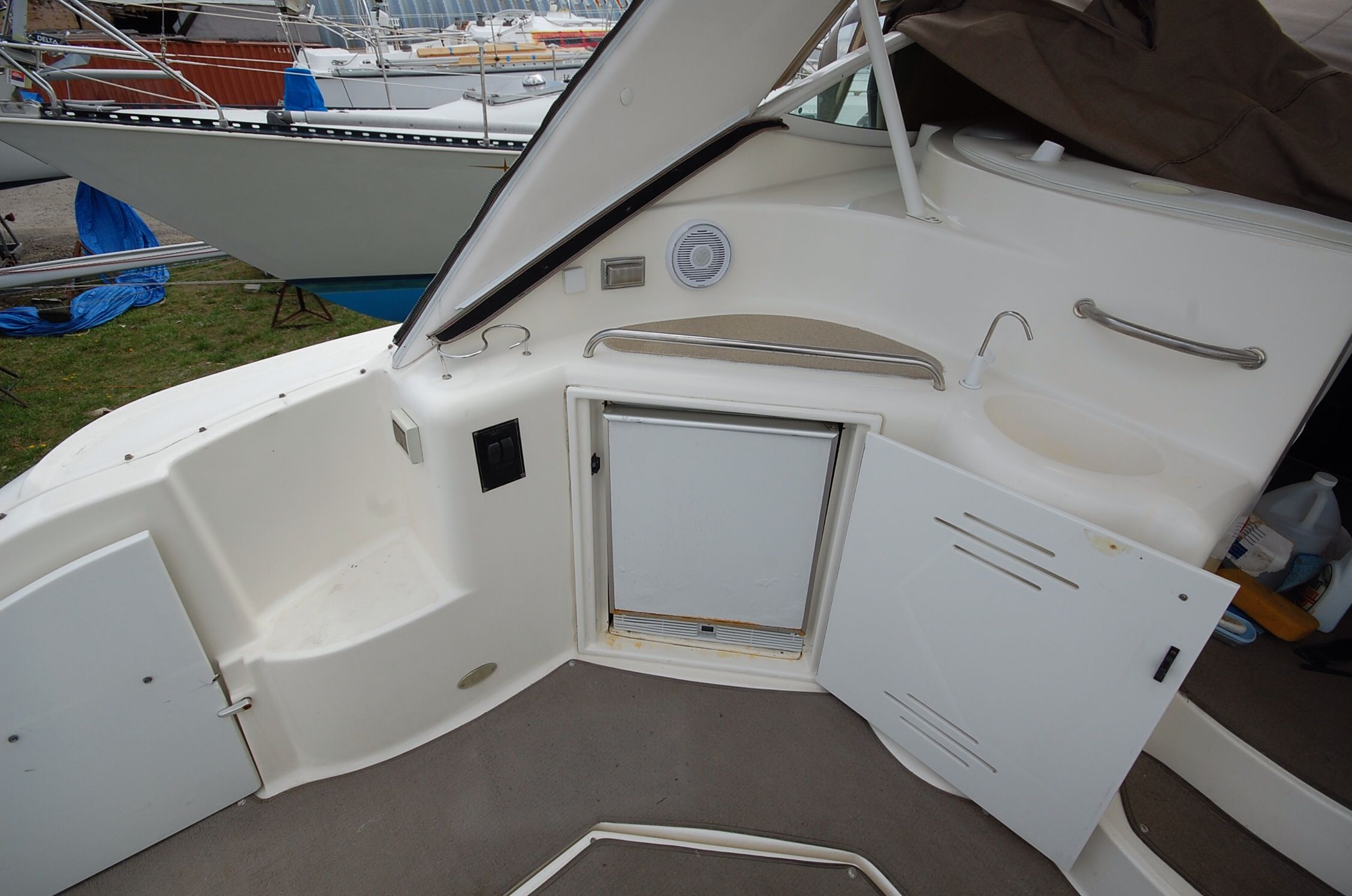 Interior of a 2004 Cruisers Yachts 3970 with fridge and sink.