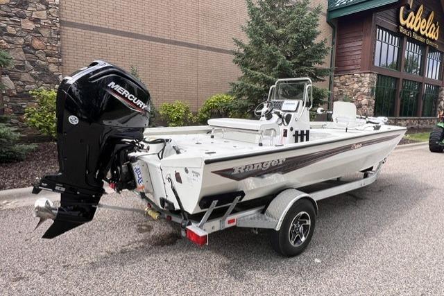 2023 Ranger RB190 boat with Mercury engine on trailer outside Cabela's store.