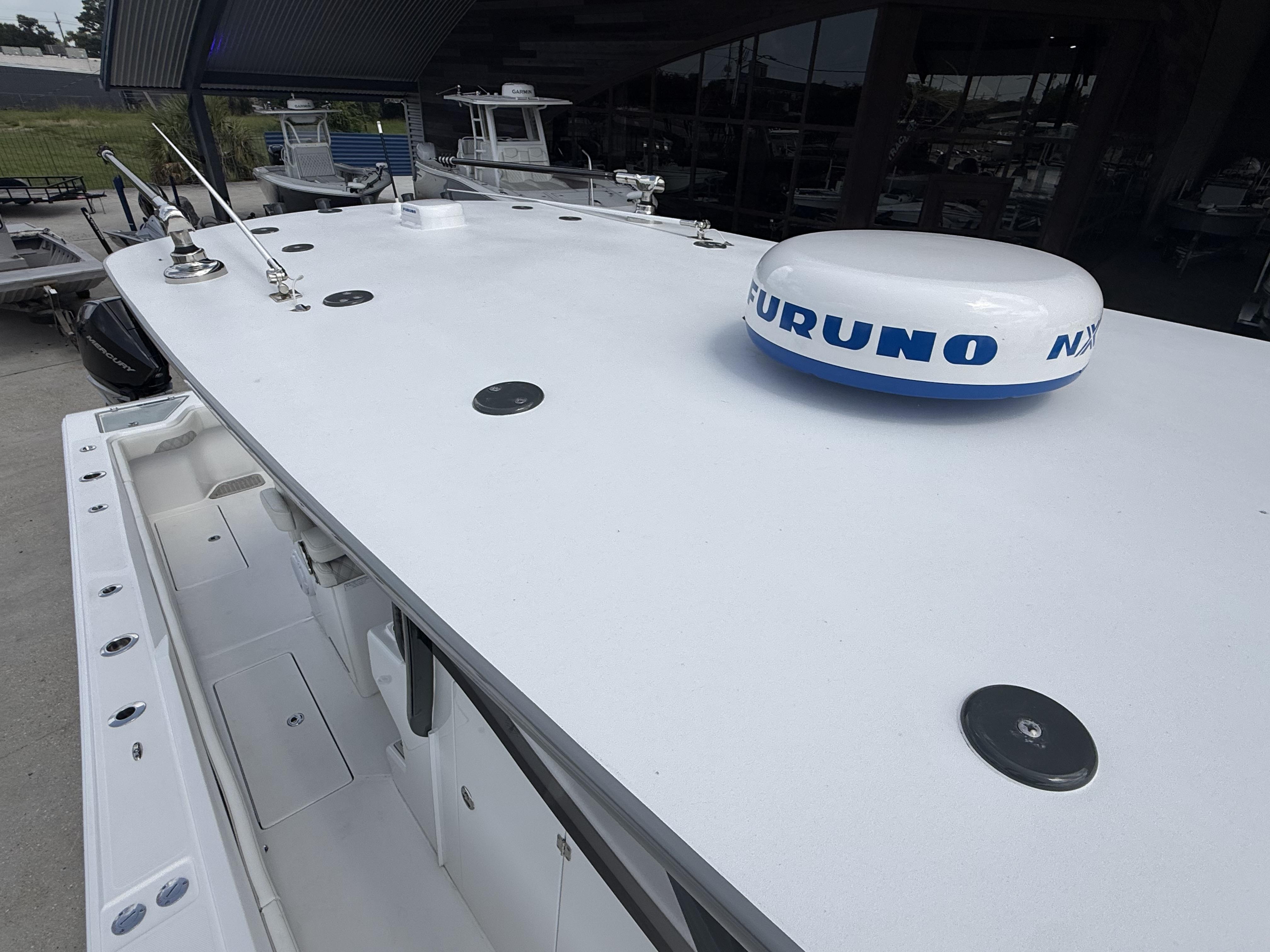 2024 Front Runner 39 CC boat with Furuno radar, docked outdoors.