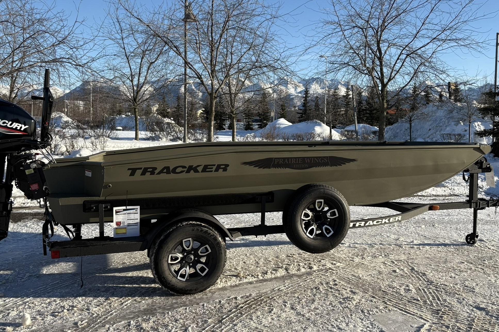 2025 Tracker Grizzly 1650 T Prairie Wings Edition boat on snowy landscape.