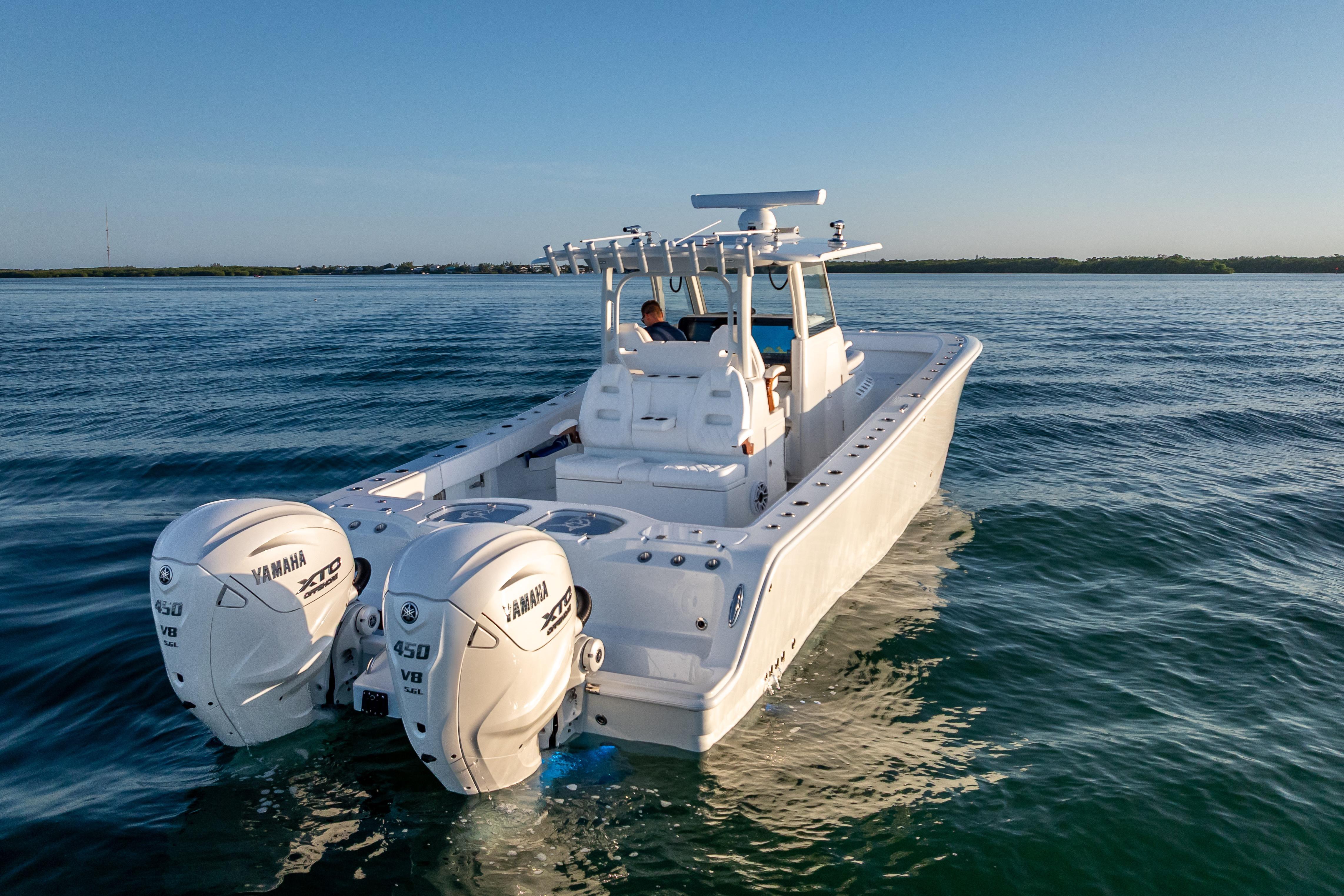 2026 Freeman 35 boat with twin Yamaha 450 engines cruising on calm water.