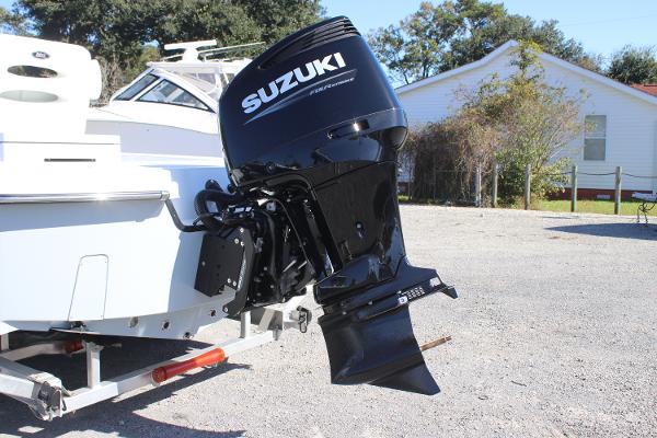 2025 East Cape 25 Open boat with Suzuki outboard motor on a trailer.