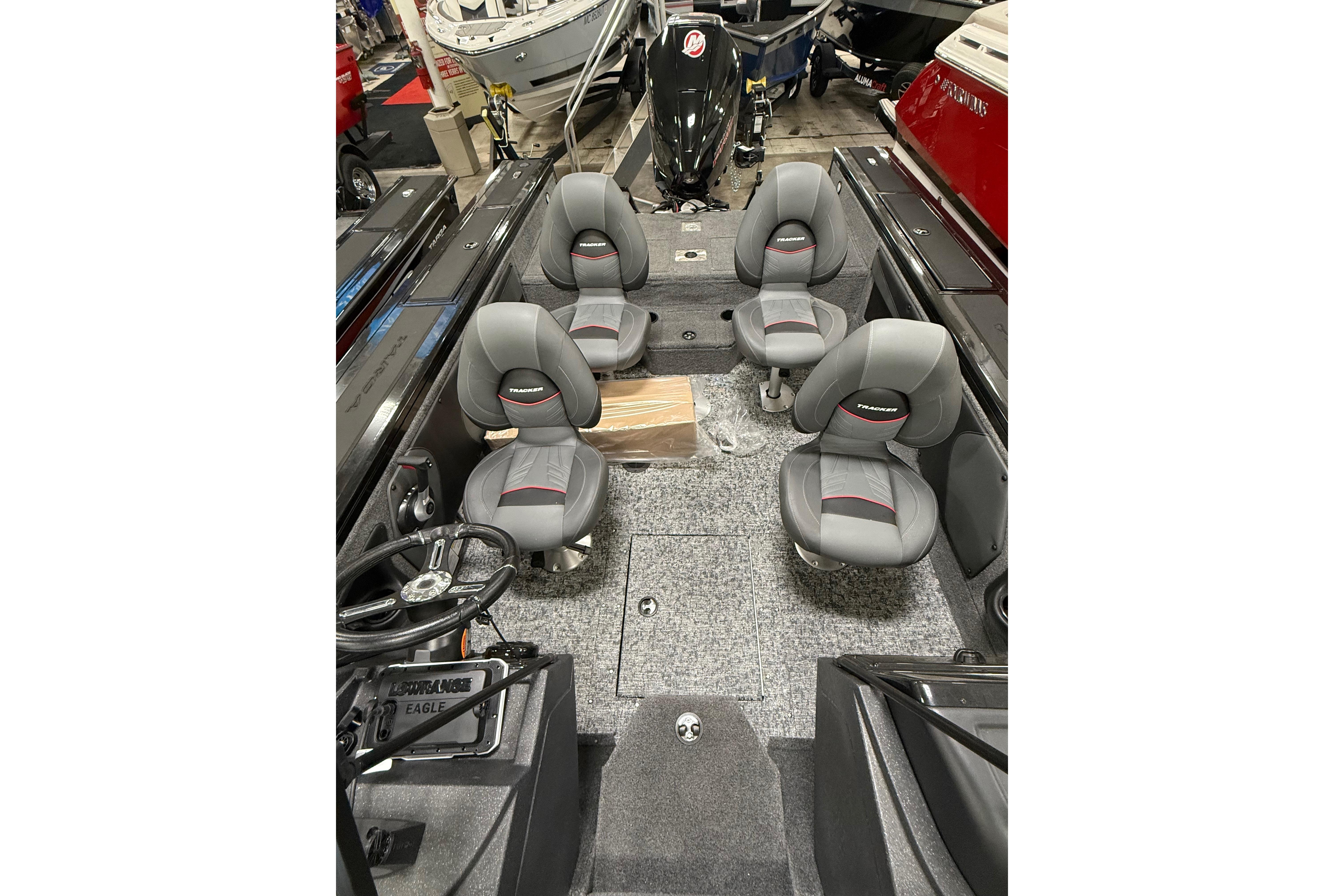 2026 Tracker Targa V-19 WT boat interior with four gray seats and steering console.