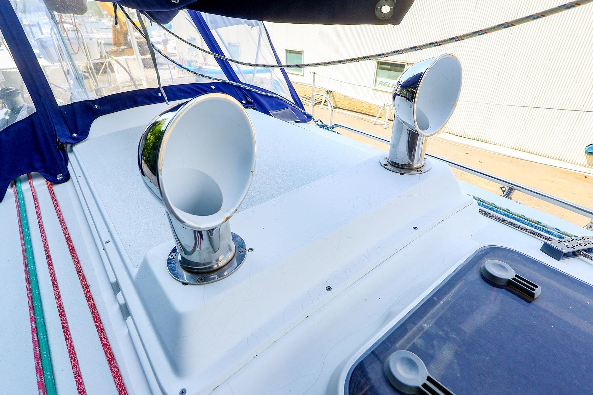 2001 J Boats J/32 deck with chrome vents and colorful ropes.