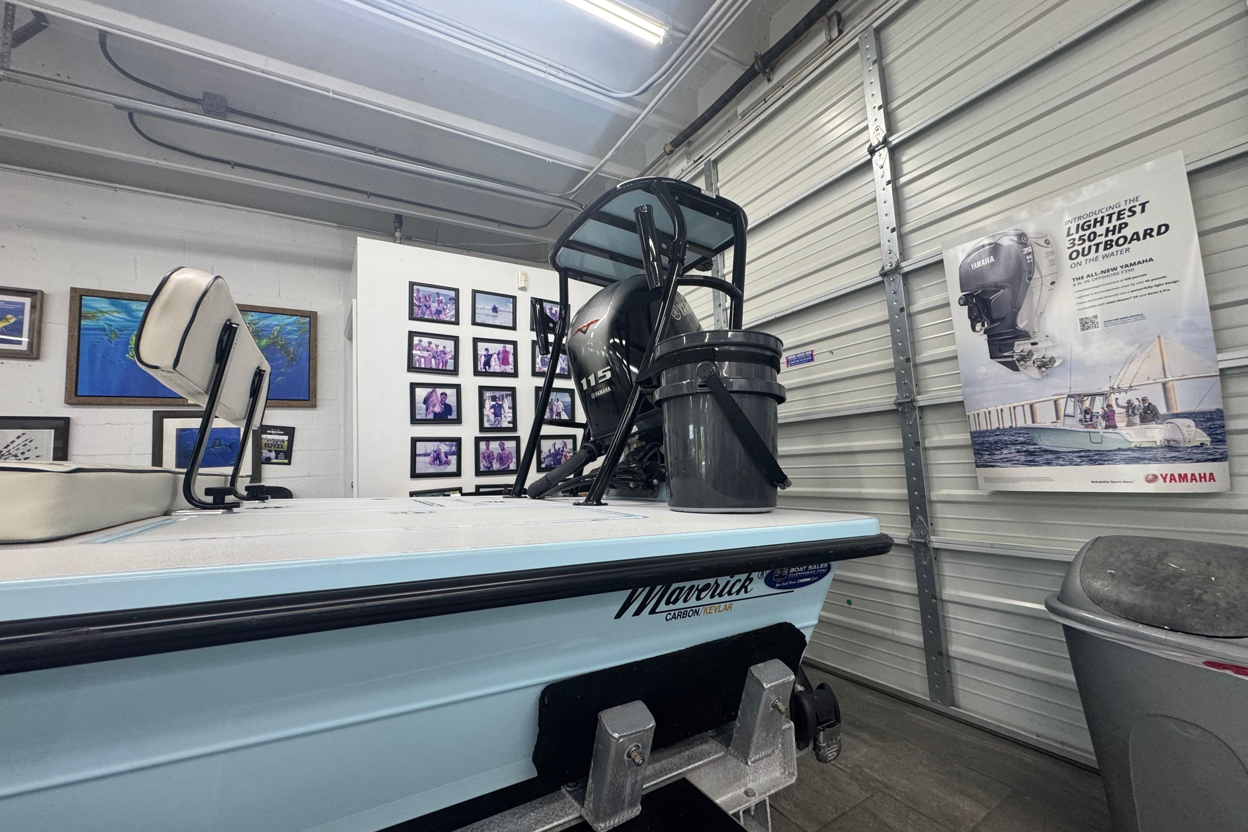 2020 Maverick Mirage 18 HPX-V boat in a garage with Yamaha outboard poster.