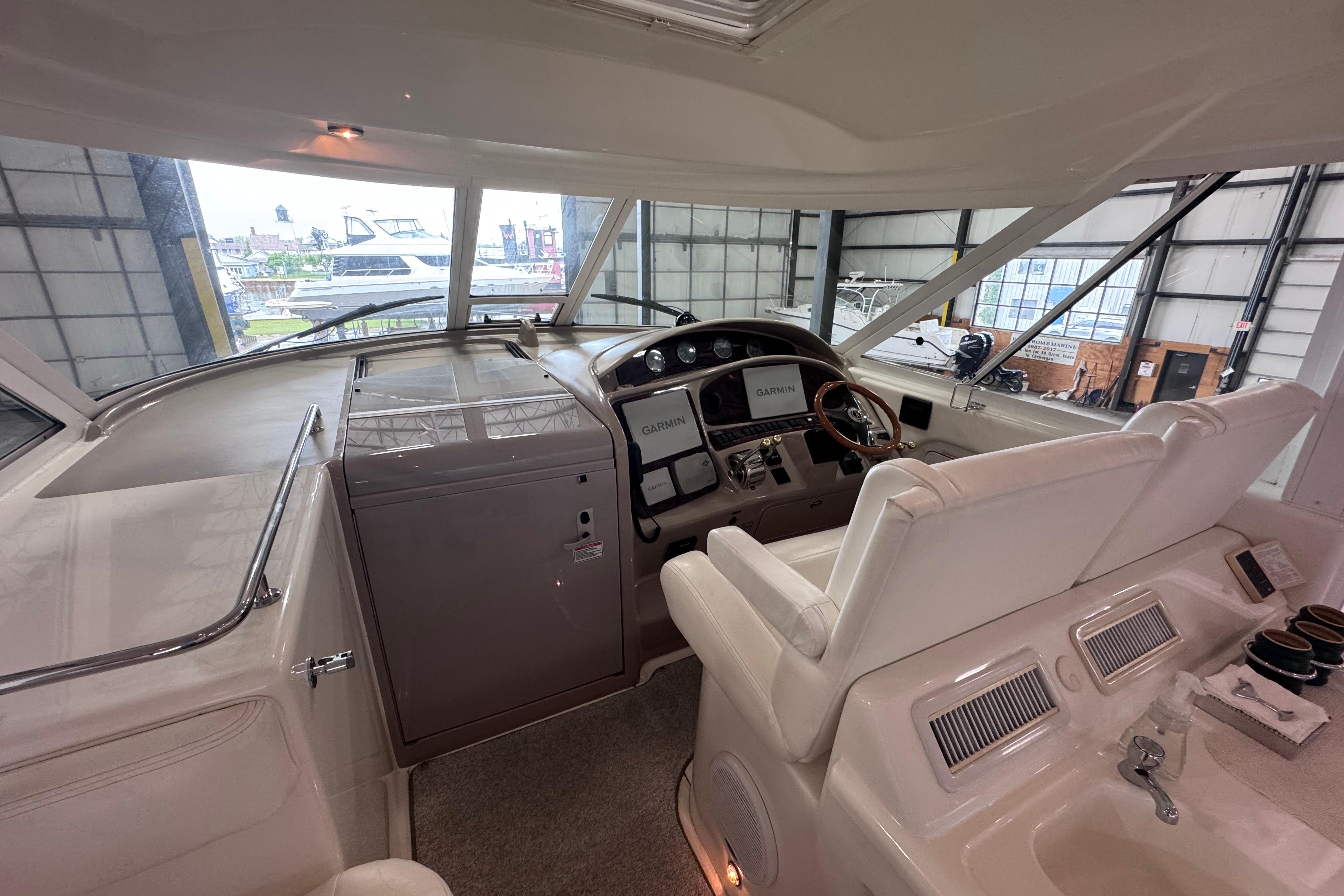 Interior view of 2004 Sea Ray 390 Motor Yacht helm with navigation equipment.
