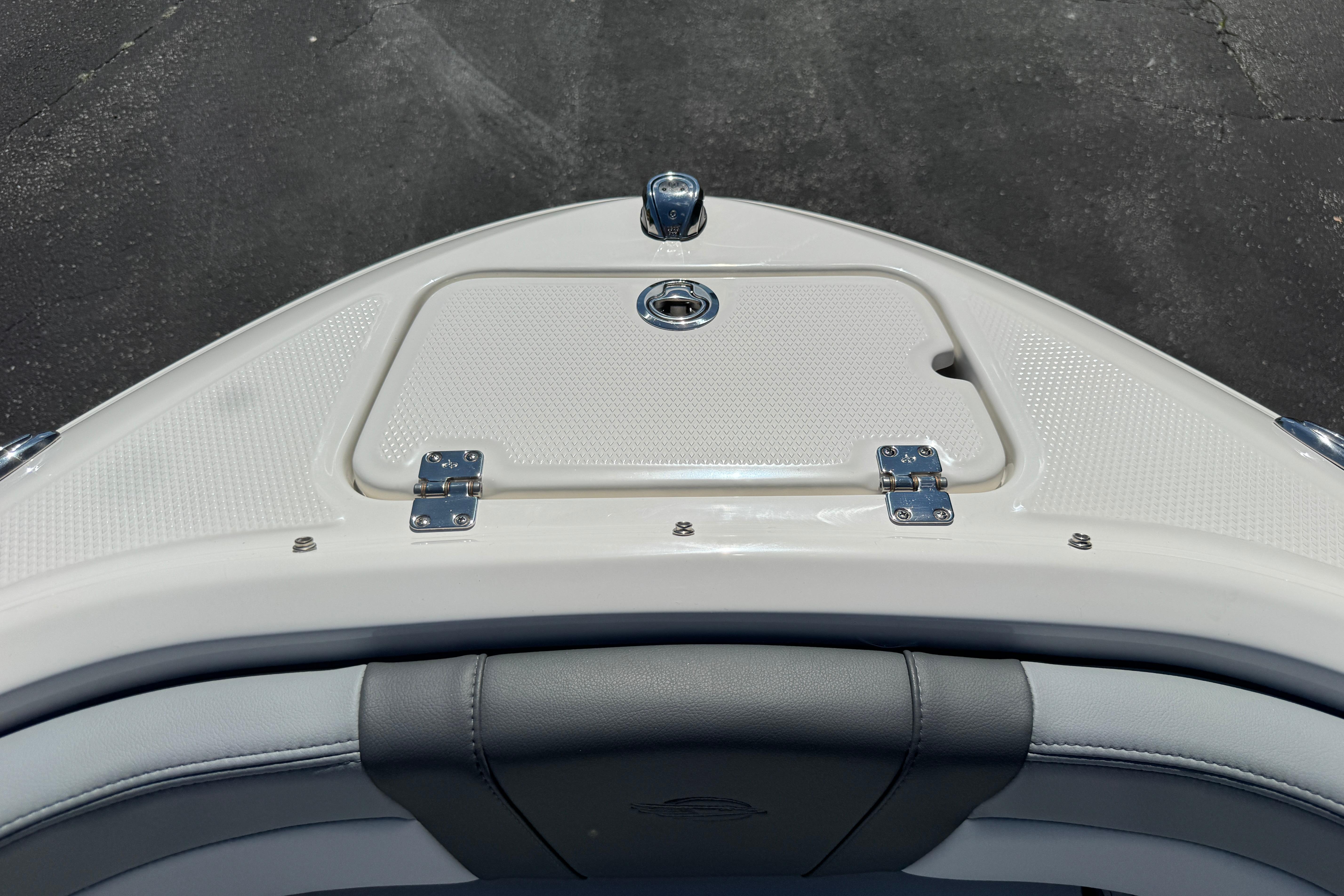 2026 Chaparral 21 SSi boat bow with storage compartment and sleek design.