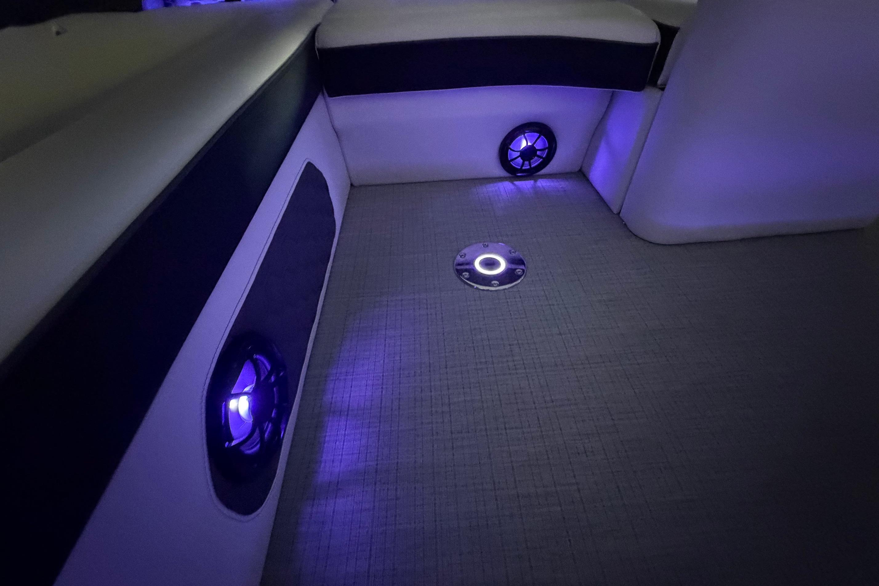 Interior of 2026 South Bay 525SB2 boat with ambient blue lighting.