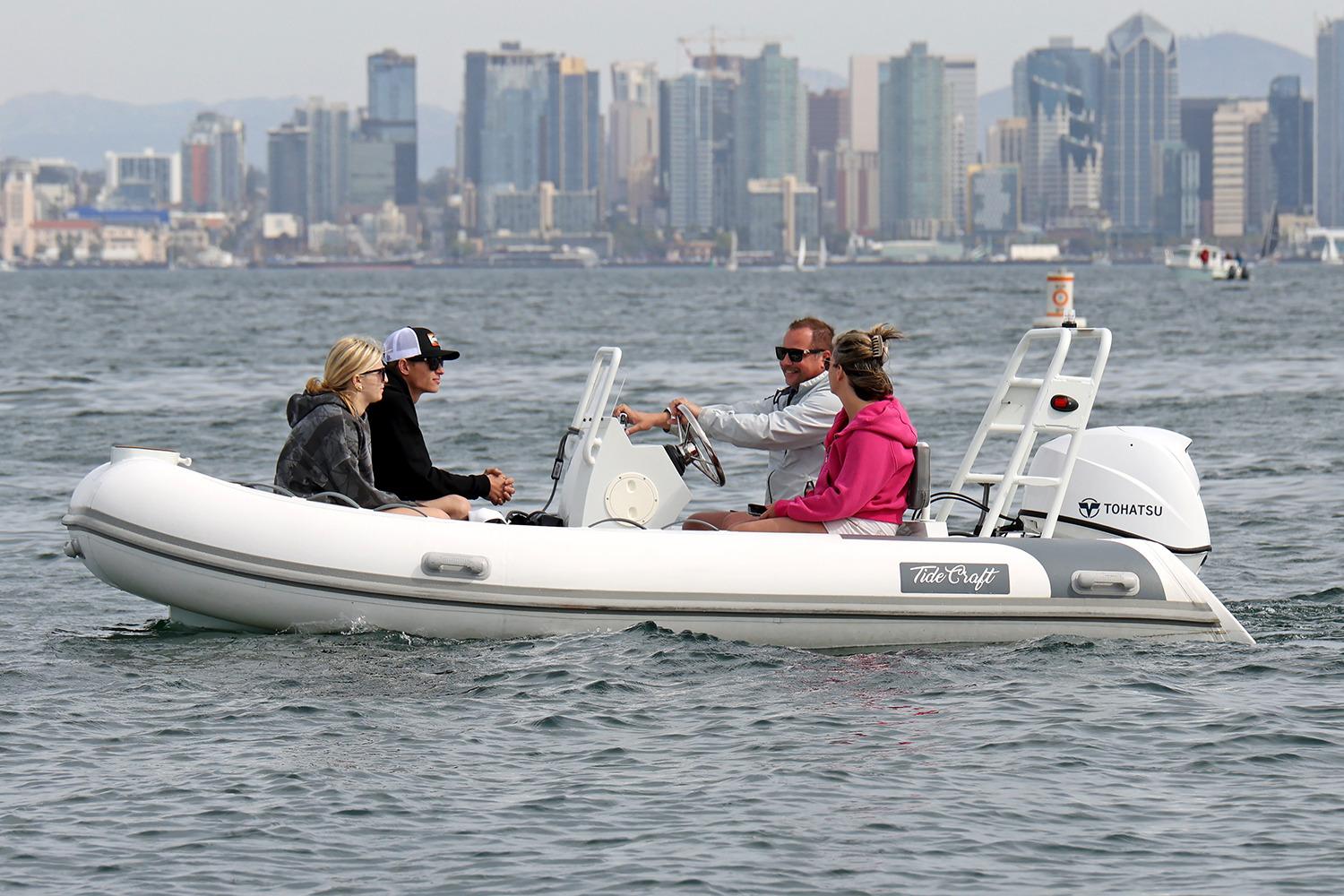 Manufacturer Provided Image: 2025 Tide Craft Catalina 13 boat with passengers on water, city skyline in background.