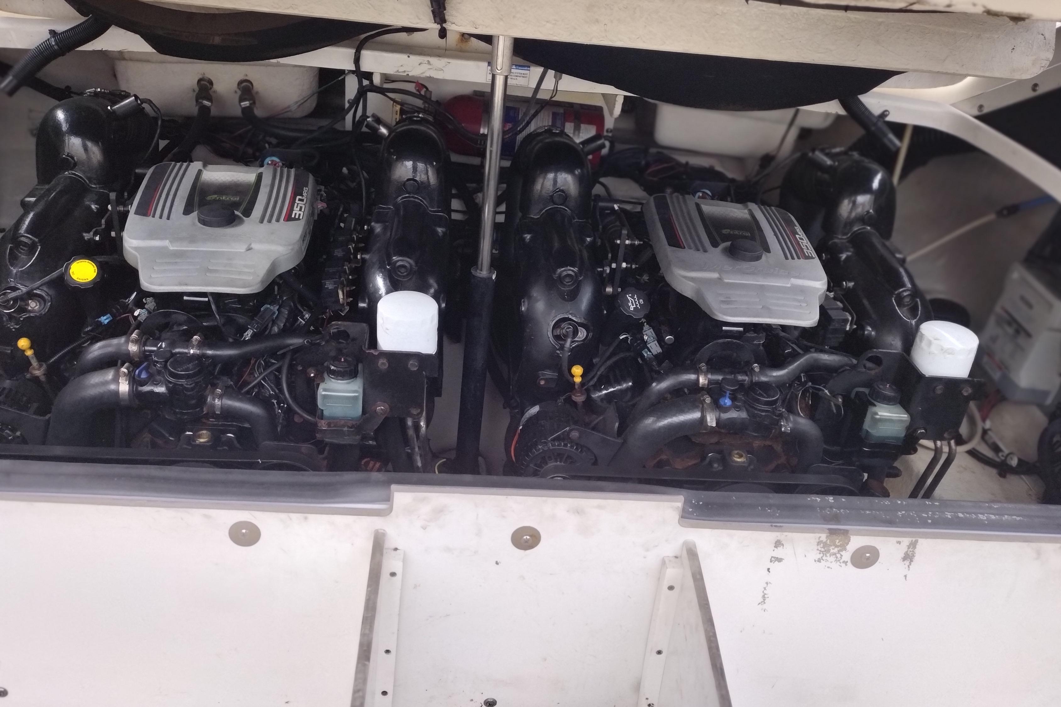 Twin engines of a 2013 Sea Ray 300 SLX boat, showcasing detailed mechanics.